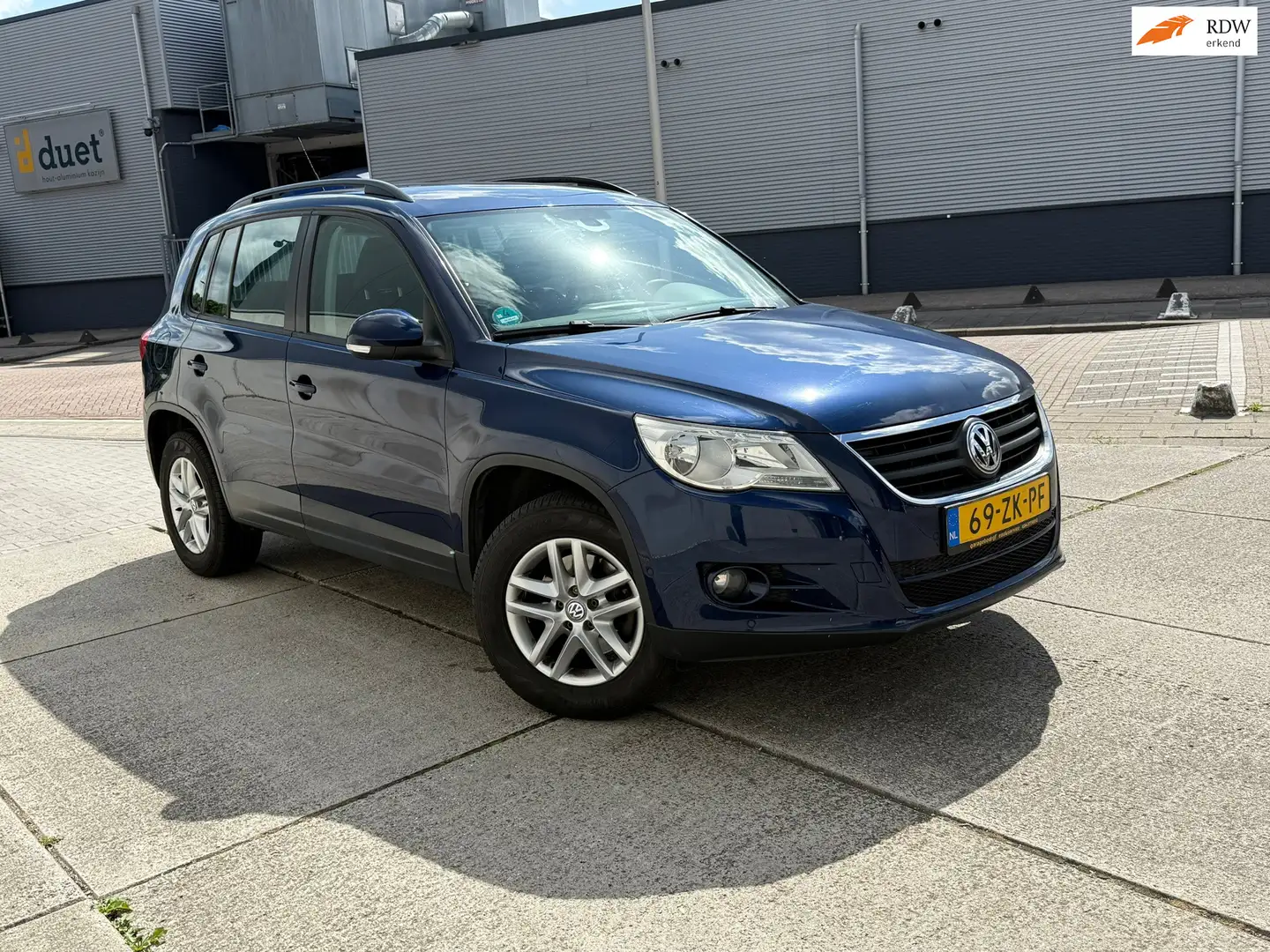 Volkswagen Tiguan 1.4 TSI Comfort&Design 4Motion Volledig onderhoude Blauw - 1