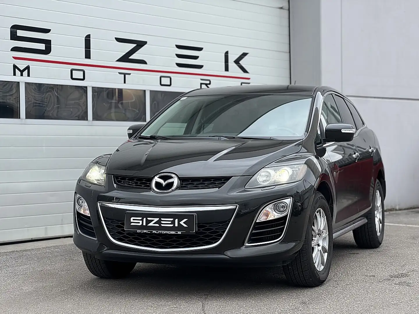 Mazda CX-7 CD173 Revolution Schwarz - 1