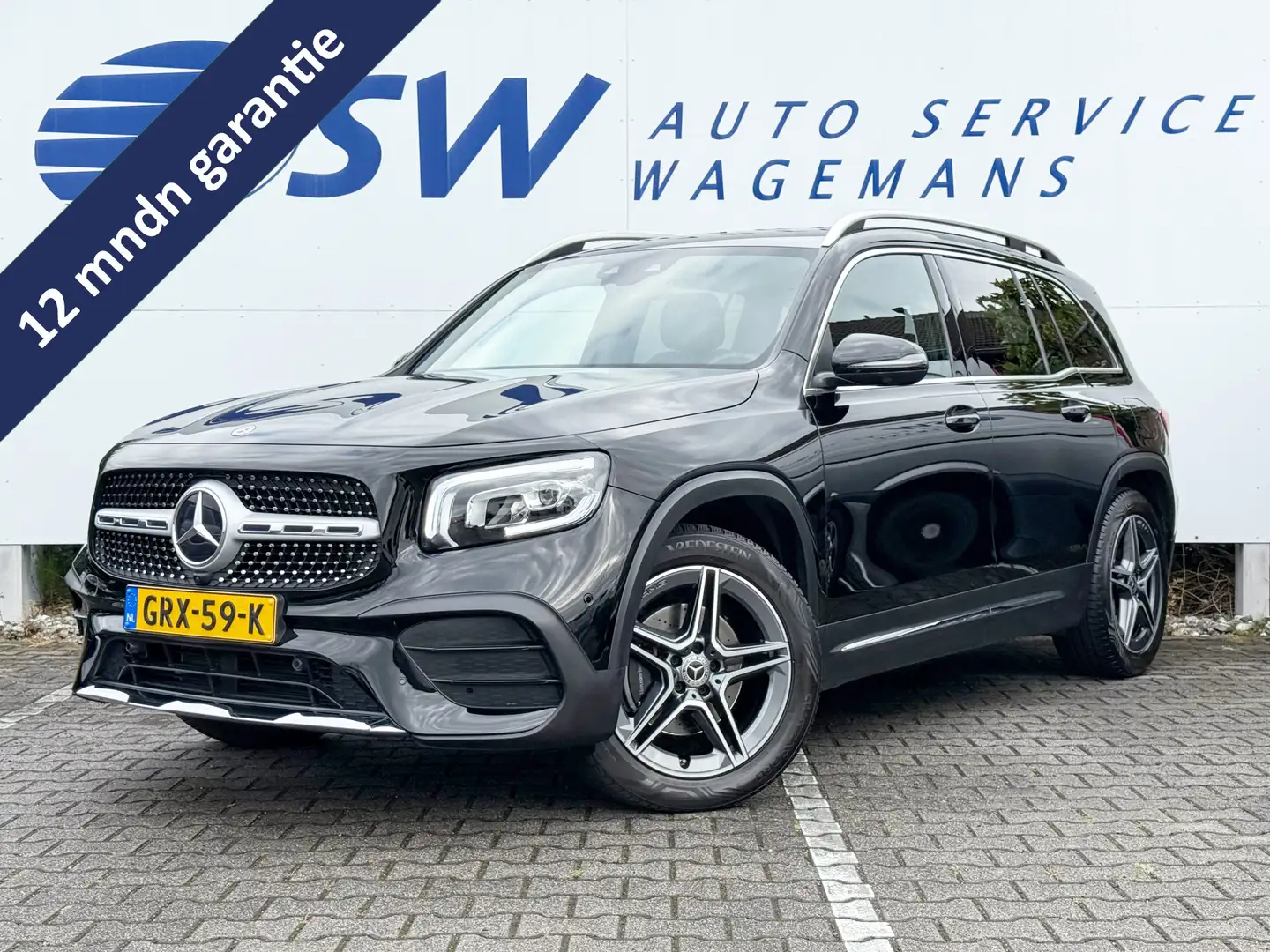 Mercedes-Benz GLB 200 Business Solution AMG | Trekhaak | Navi | 360* Cam Zwart - 1