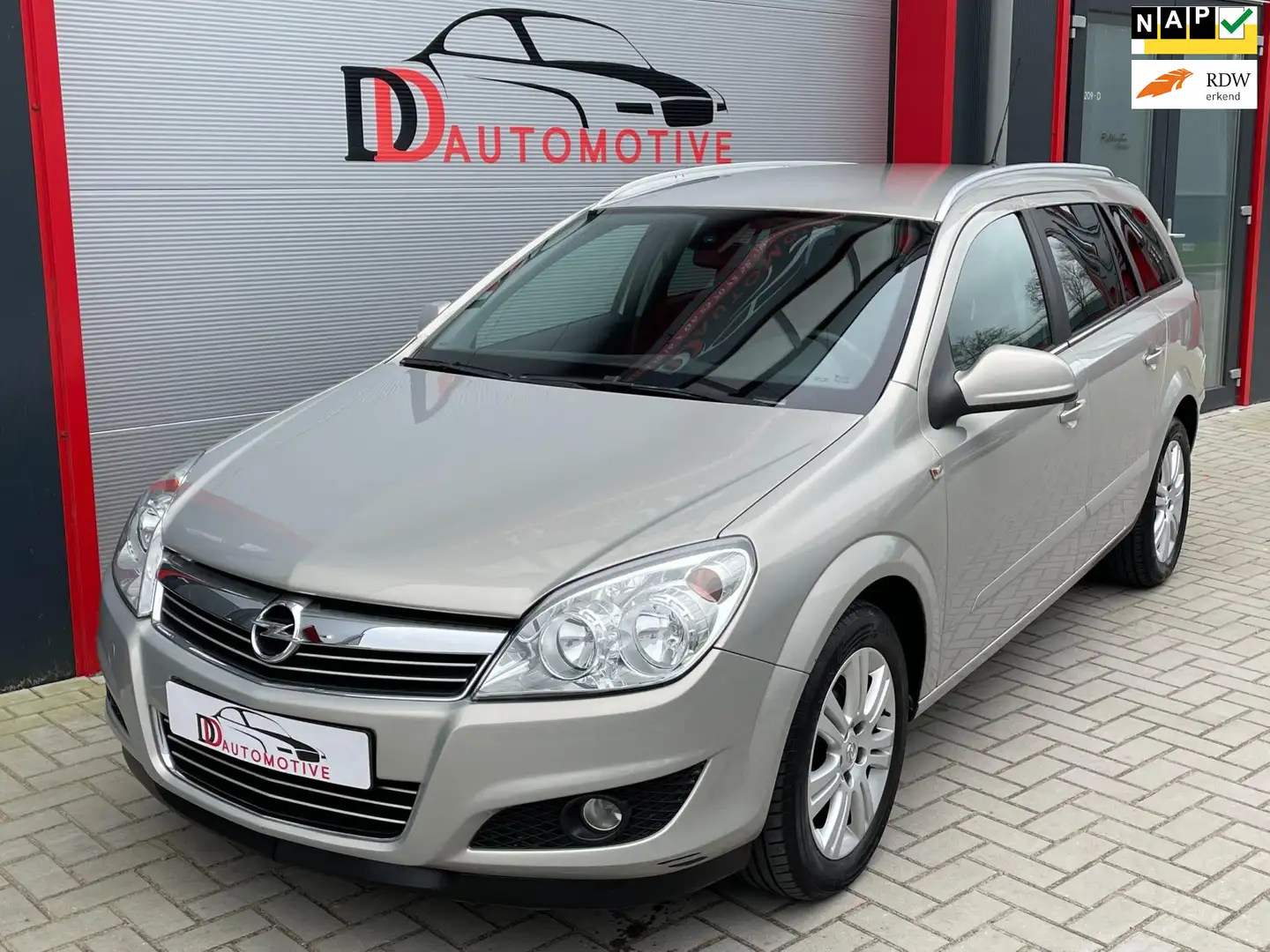 Opel Astra Wagon 1.6 Cosmo LEER/NAV/PDC/CRUISE/CLIMA/NAP/ORGN Beige - 1