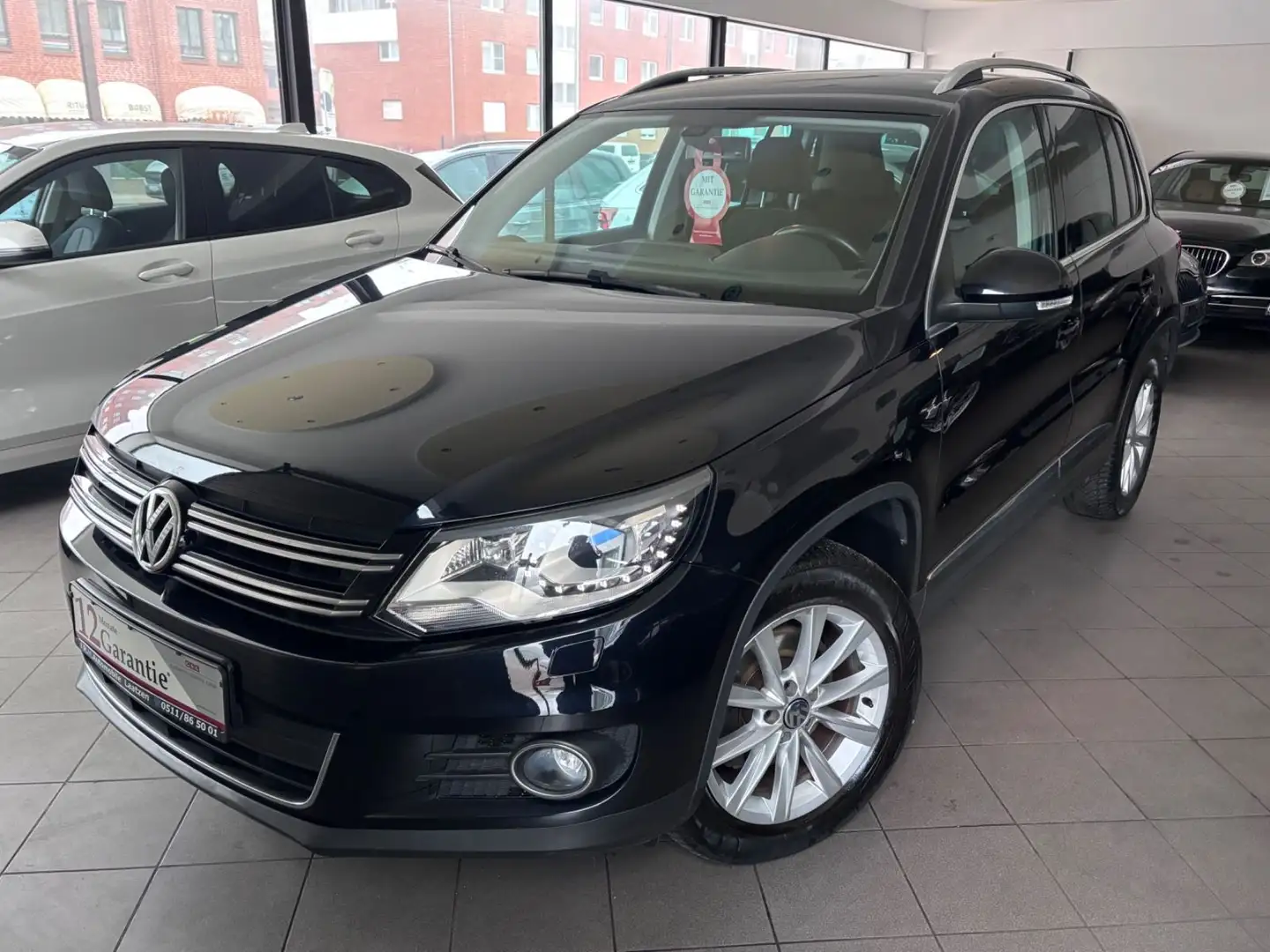 Volkswagen Tiguan Sport 4Motion Automatik~Navi~SHZ~PDC Schwarz - 1
