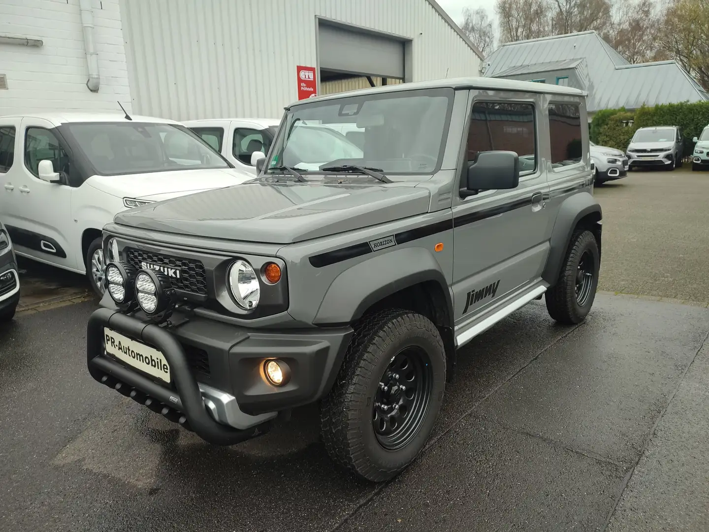Suzuki Jimny Jimny 1.5 ALLGRIPNFZ Horizon Klima/AHK/Navi Gris - 1