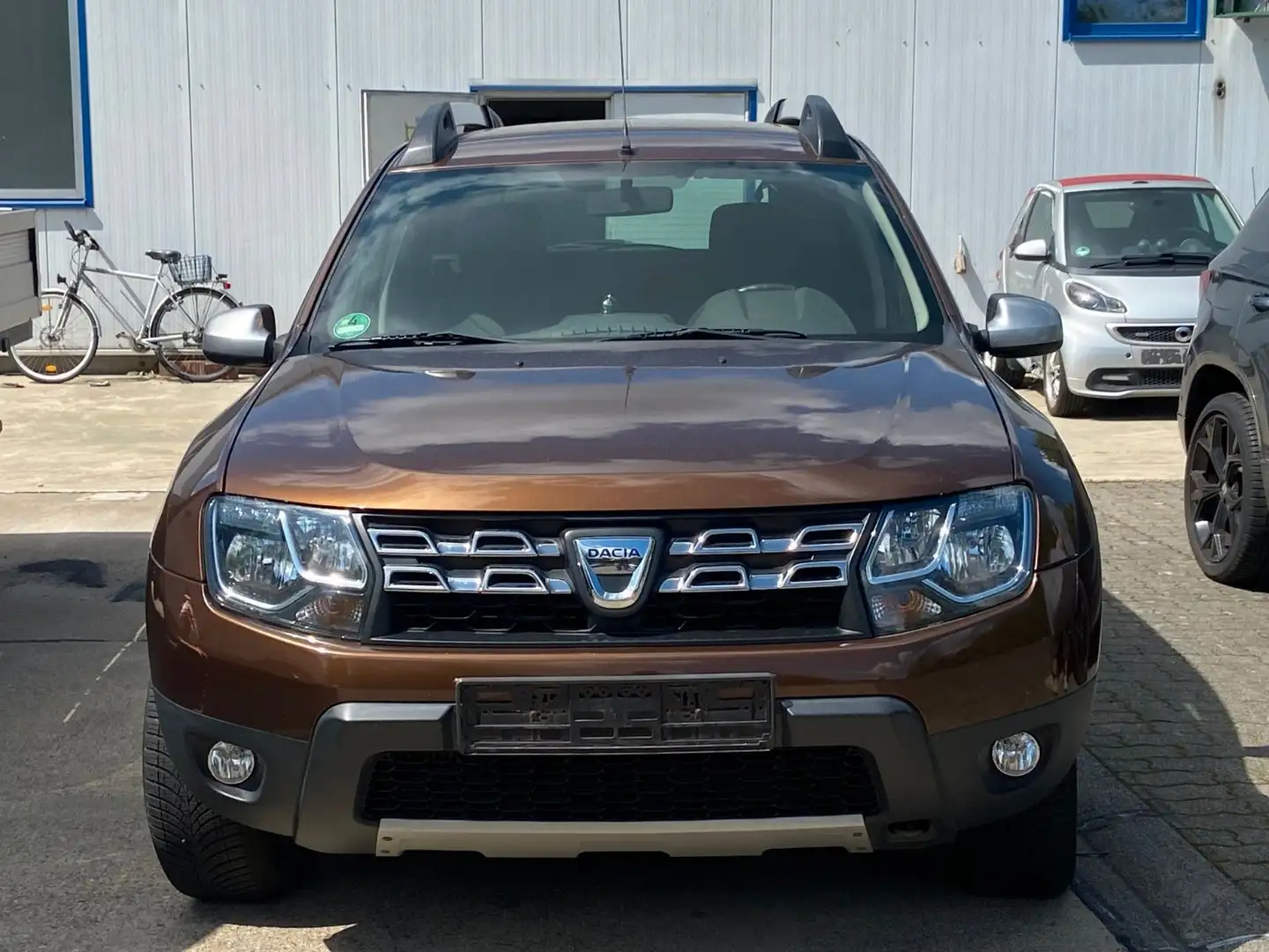 Dacia Duster I Prestige 4x2*Navi*Tempo*PDC*SHZ* Braun - 1