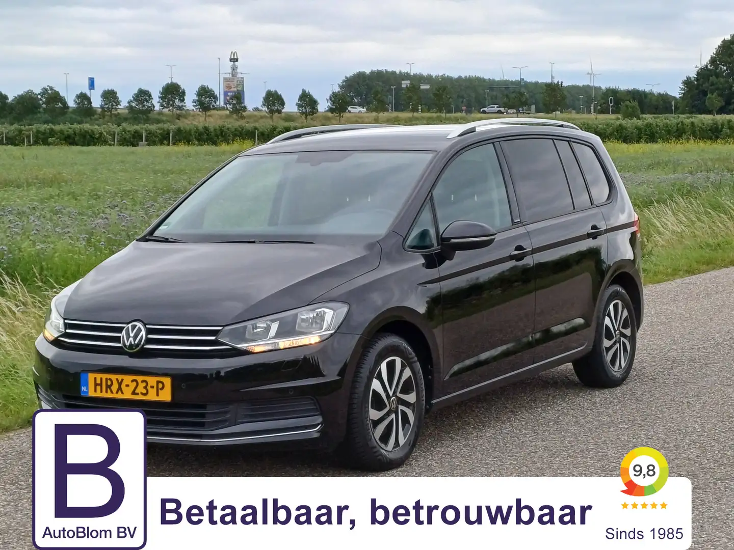 Volkswagen Touran 1.5 TSI Comfortline Active 7-Pers. /Navi/Clima/16" Zwart - 1