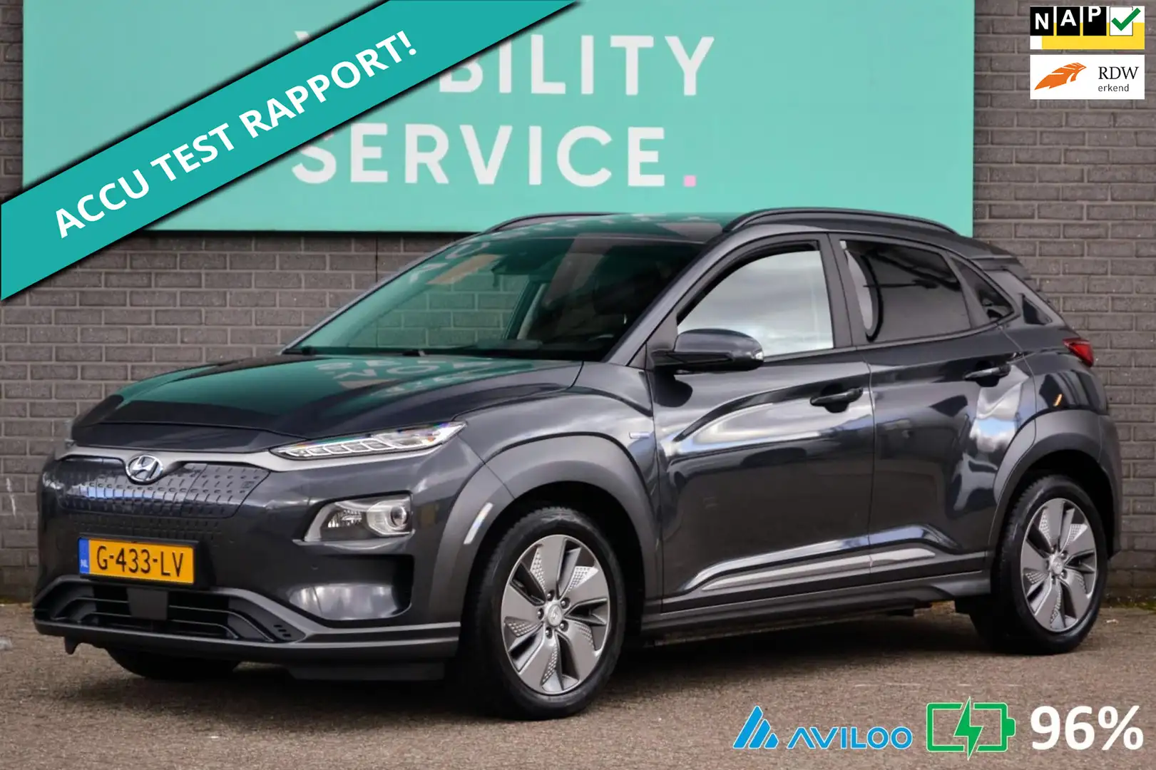 Hyundai KONA EV Premium 64 kWh SOH96% Clima ACC CarPlay Leder L Grijs - 1