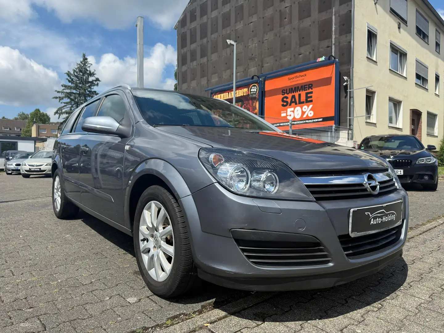 Opel Astra 1.6 16v Caravan Easytronic Edition PDC RDK Grijs - 1