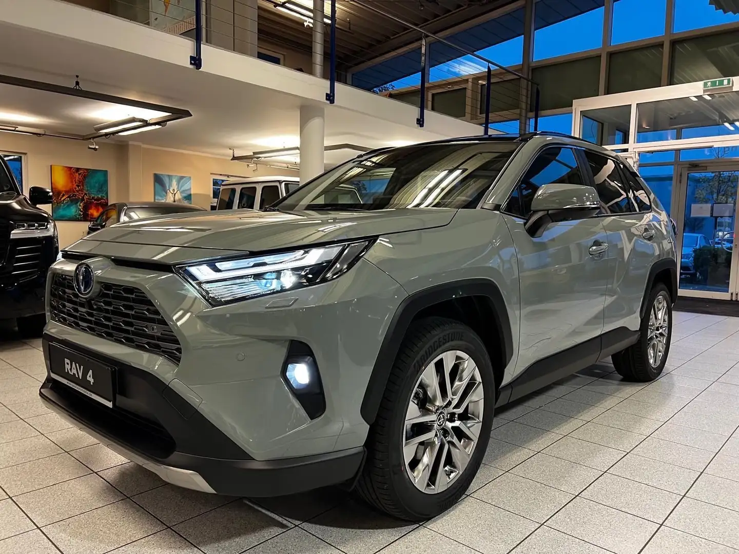 Toyota RAV 4 LOUNGE-4x4-JBL-PANORAMA-360 CAM.-Hybrid Grün - 1