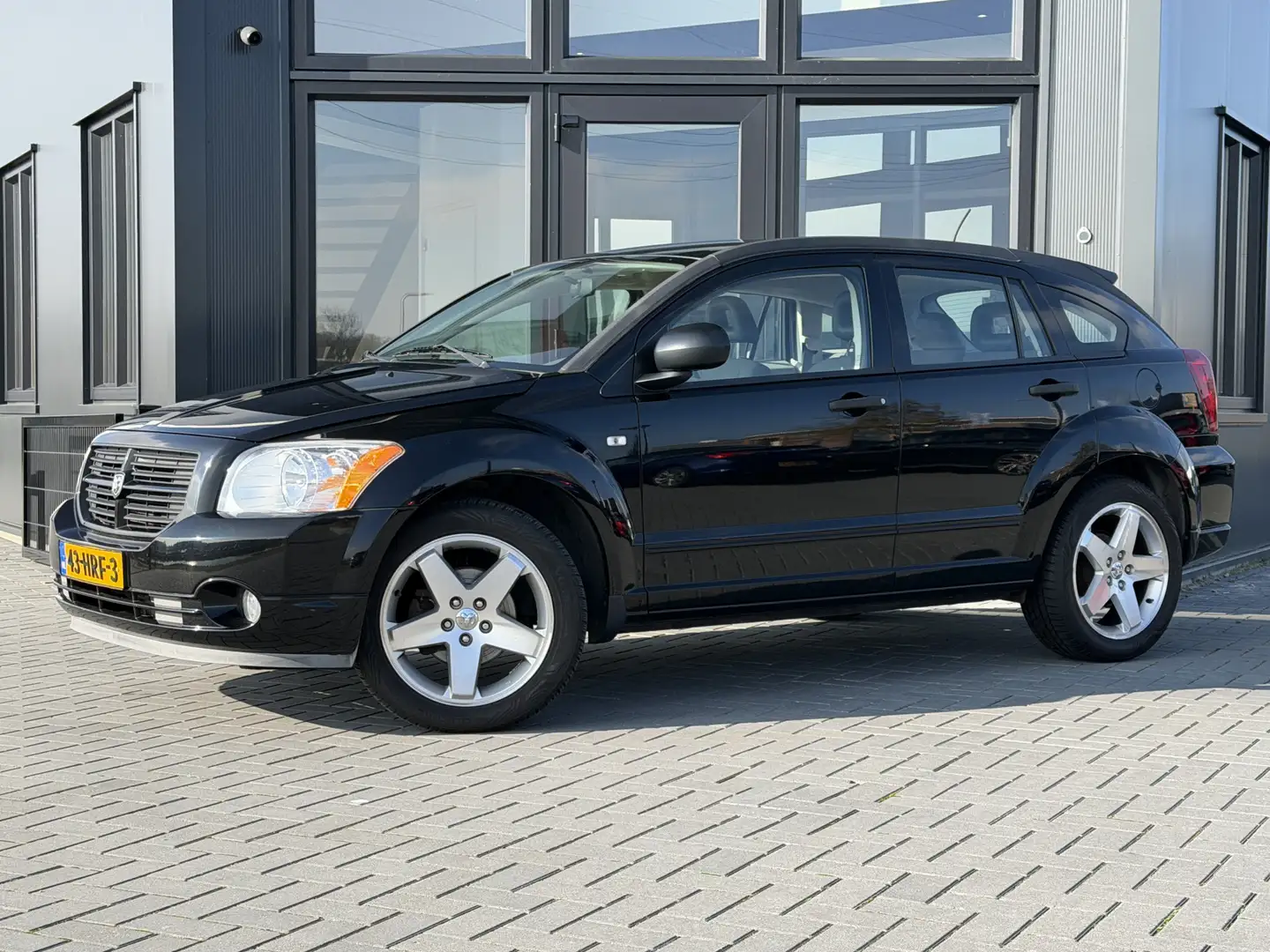 Dodge Caliber 1.8 SXT Airco | Cruise | Navi | Nwe APK | Org NL Schwarz - 1