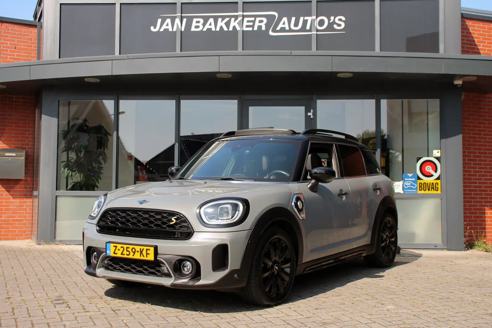 MINI Cooper S Countryman Mini 2.0 E ALL4 ✅ panorama dak ✅ Leder ✅ Carplay ✅ Grijs - 1