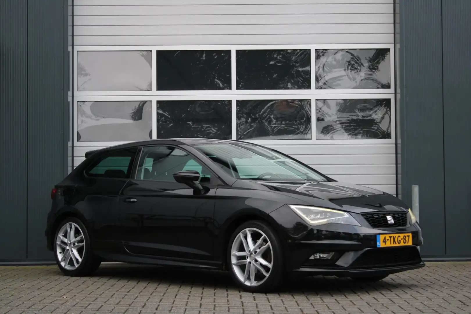 SEAT Leon SC 1.4 TSI FR Business 140pk Clima/Cruise/Navi/Blu Zwart - 1
