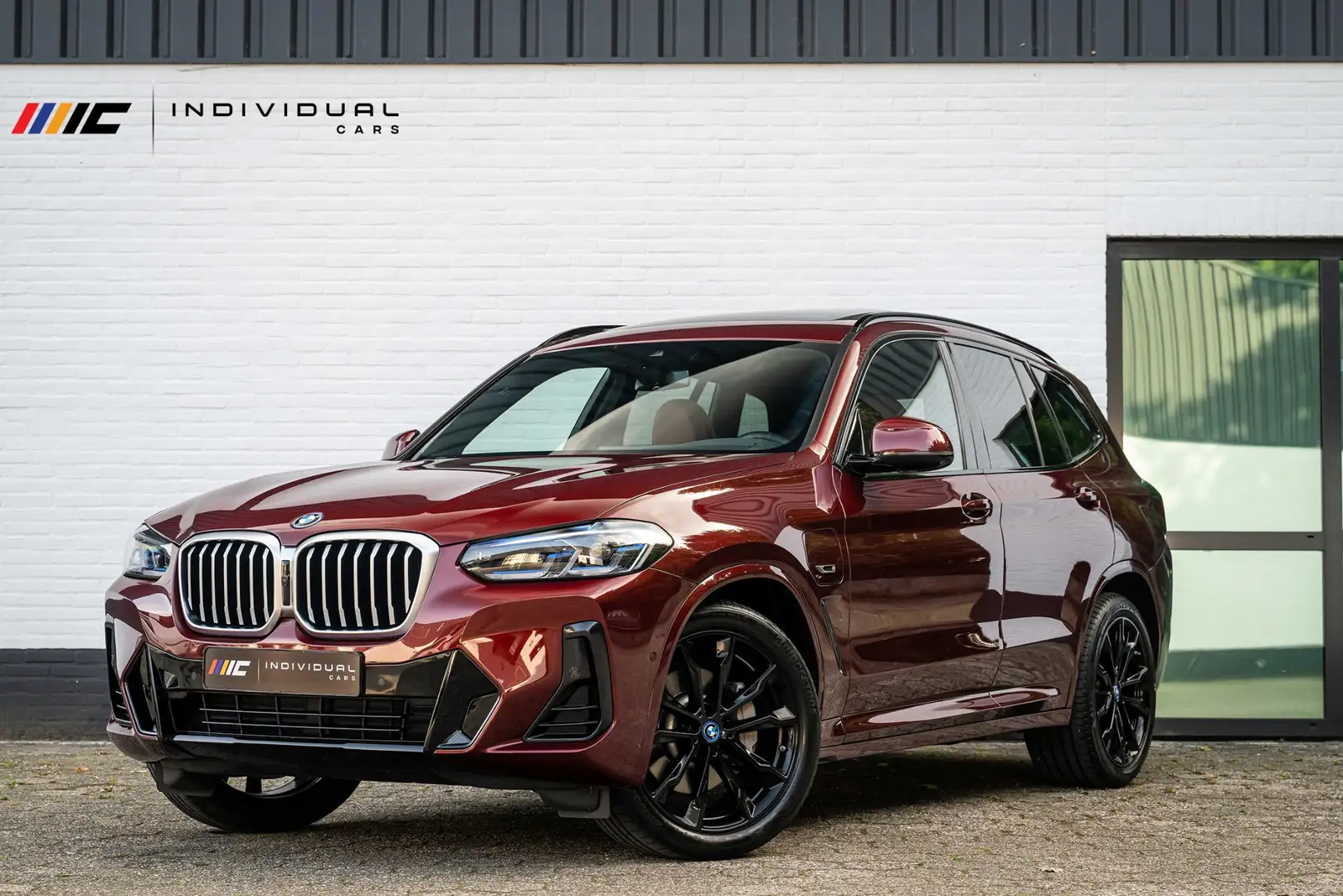 BMW X3 xDrive30e M-Sport INDIVIDUAL Carbon Tartufo Pano Rood - 1