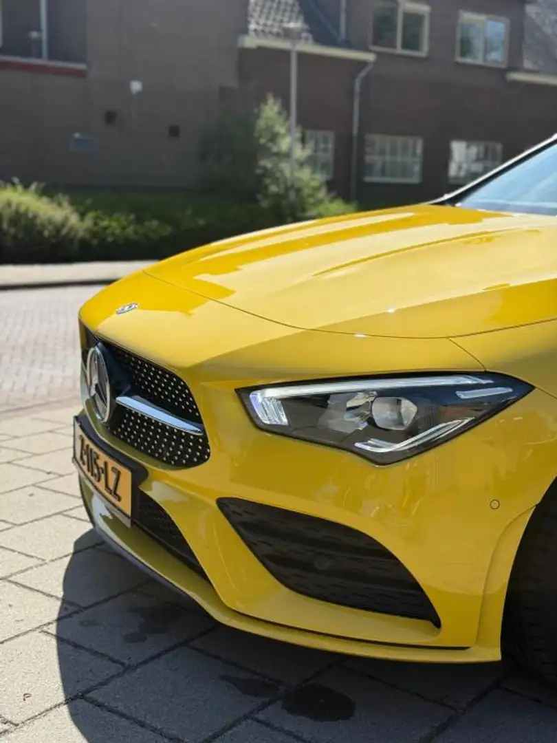 Mercedes-Benz CLA 180 AMG Line | Edition 1 | Panoramadak | Geel | 2019 Geel - 2
