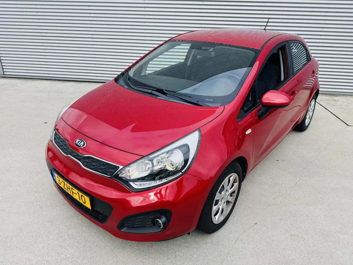 Kia Rio 1.2 BusinessLine 85pk Airco | Cruise | Bluetooth Rood - 2