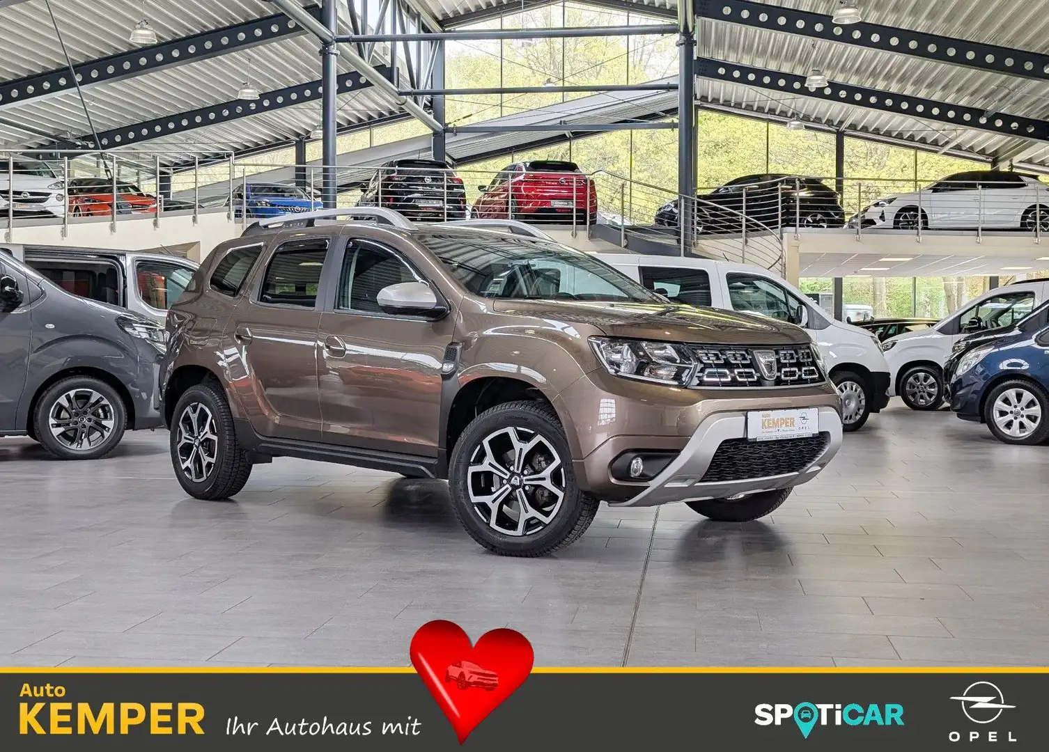 Dacia Duster 1.2 Prestige *PDC*Navi*Kamera* Braun - 1