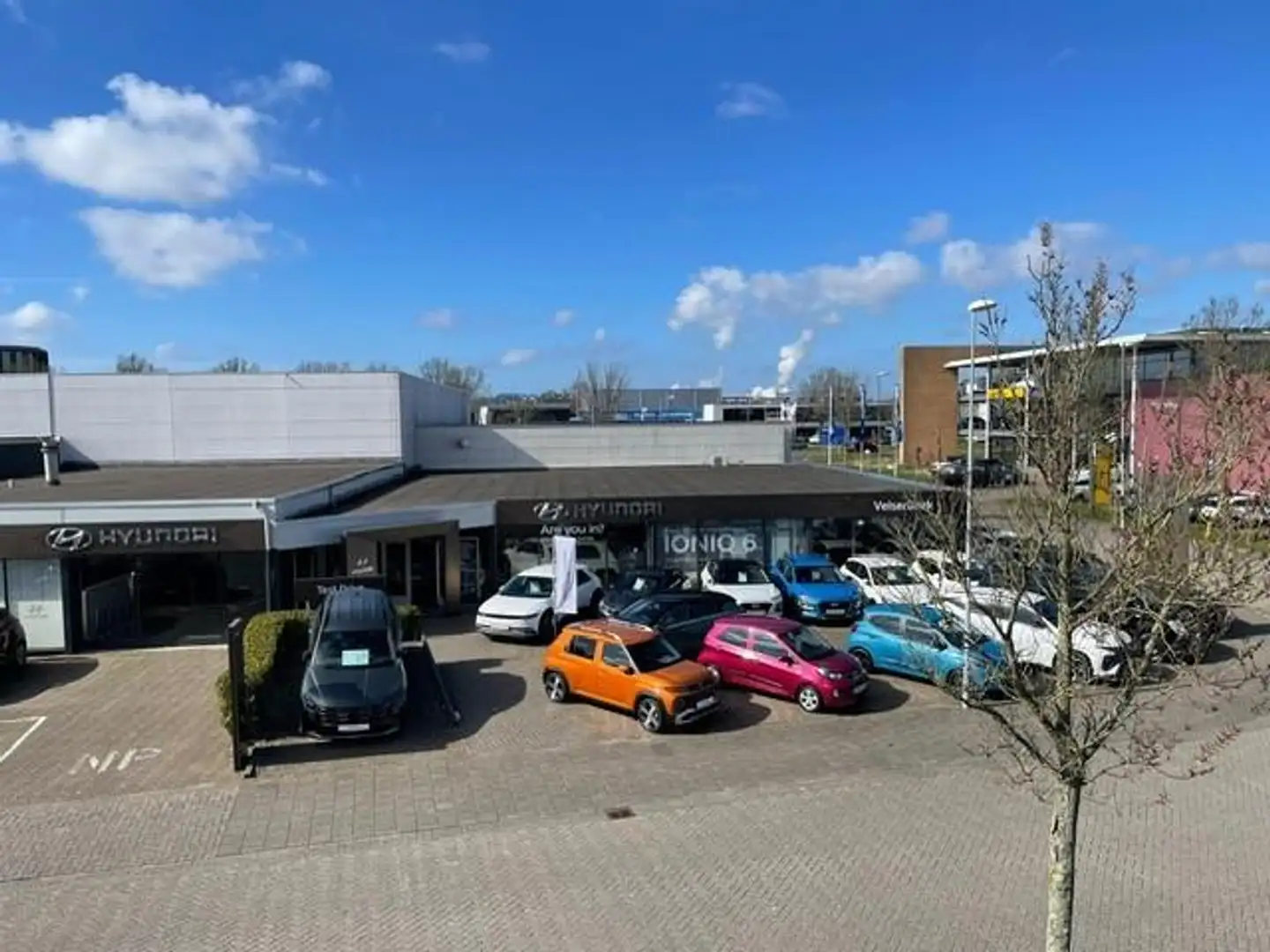 Hyundai TUCSON 1.6 T-GDI HEV Comfort *14.662 Km / Trekhaak / LMV* Rood - 2