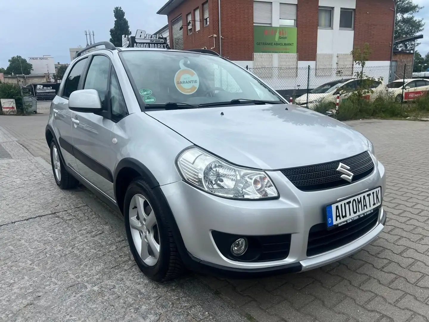 Suzuki SX4 Streetline Club,Automatik,Klima,SHZ,PDC,Allwetter Grau - 1