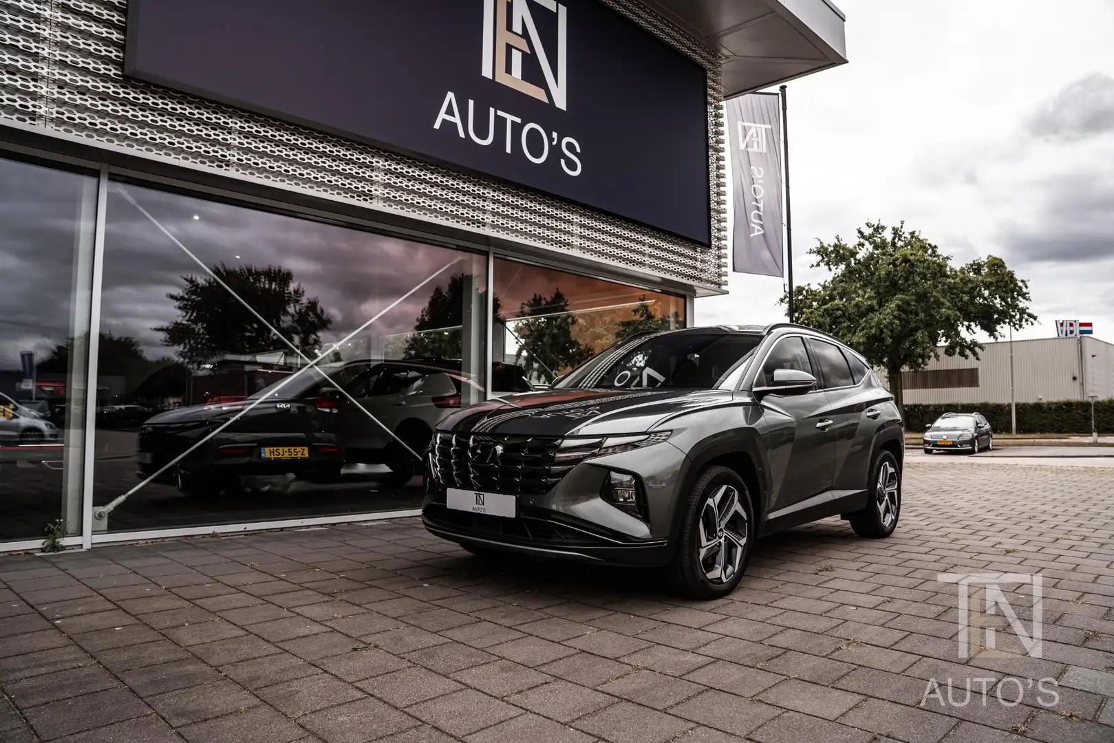 Hyundai TUCSON 1.6 T-GDI PHEV Comfort Smart 4WD | Camera | Keyles Grijs - 1