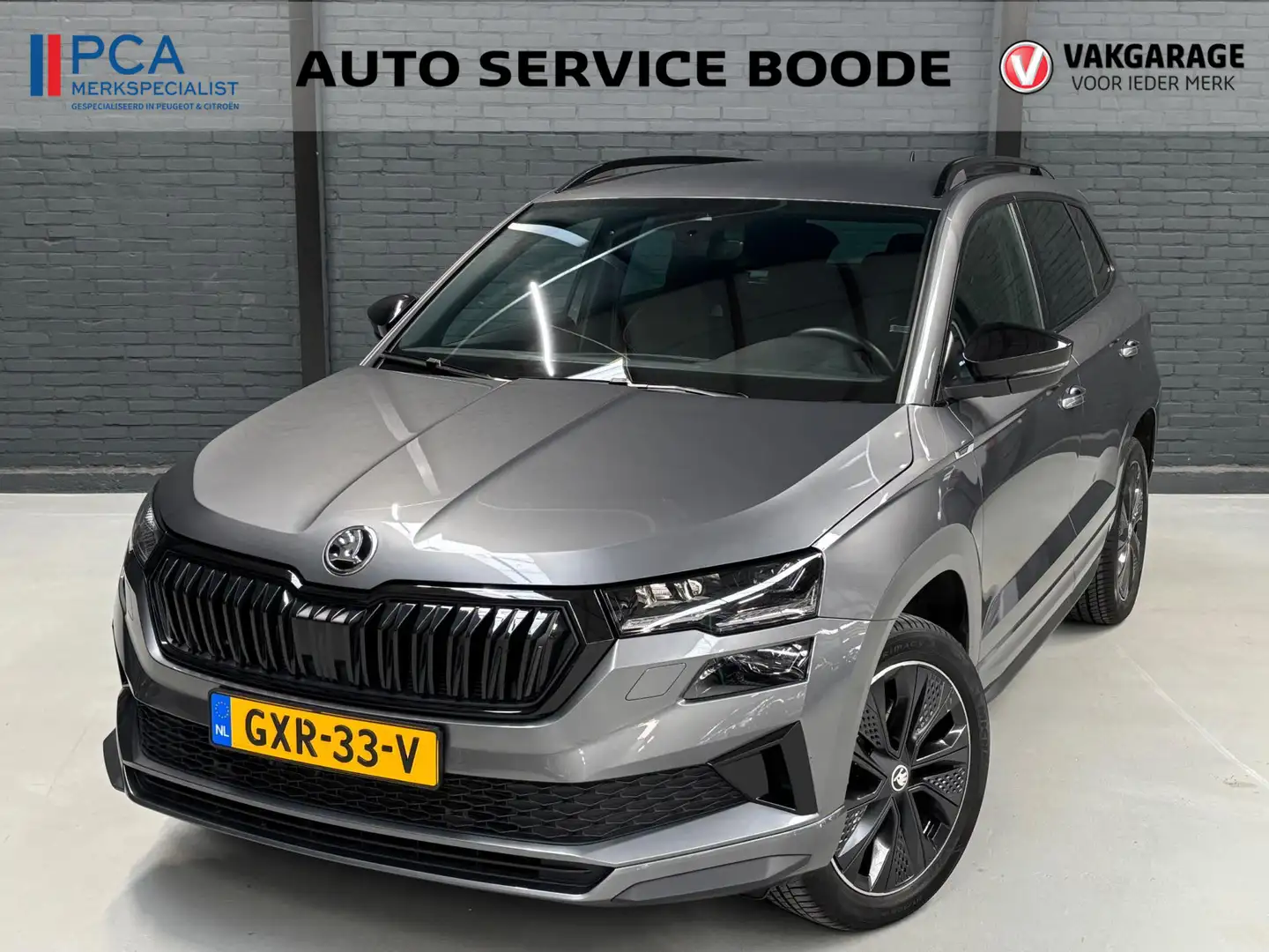 Skoda Karoq 1.5 TSI (150pk) Sportline Business automaat - Appl Gris - 1