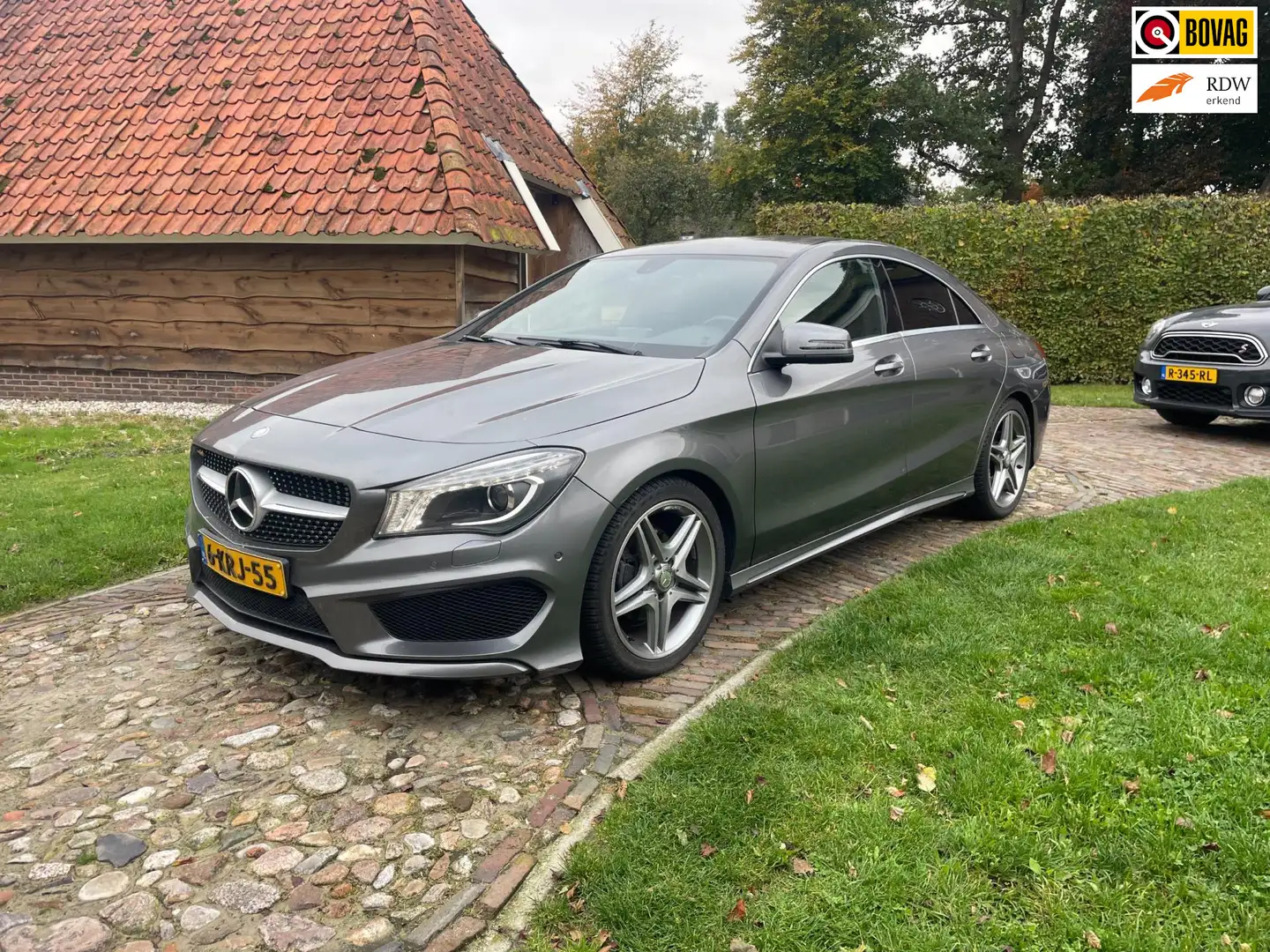 Mercedes-Benz CLA 200 Ambition-NL AUTO-NAVI-AMG LINE-PDC-18"-HARMAN KARD Grijs - 1