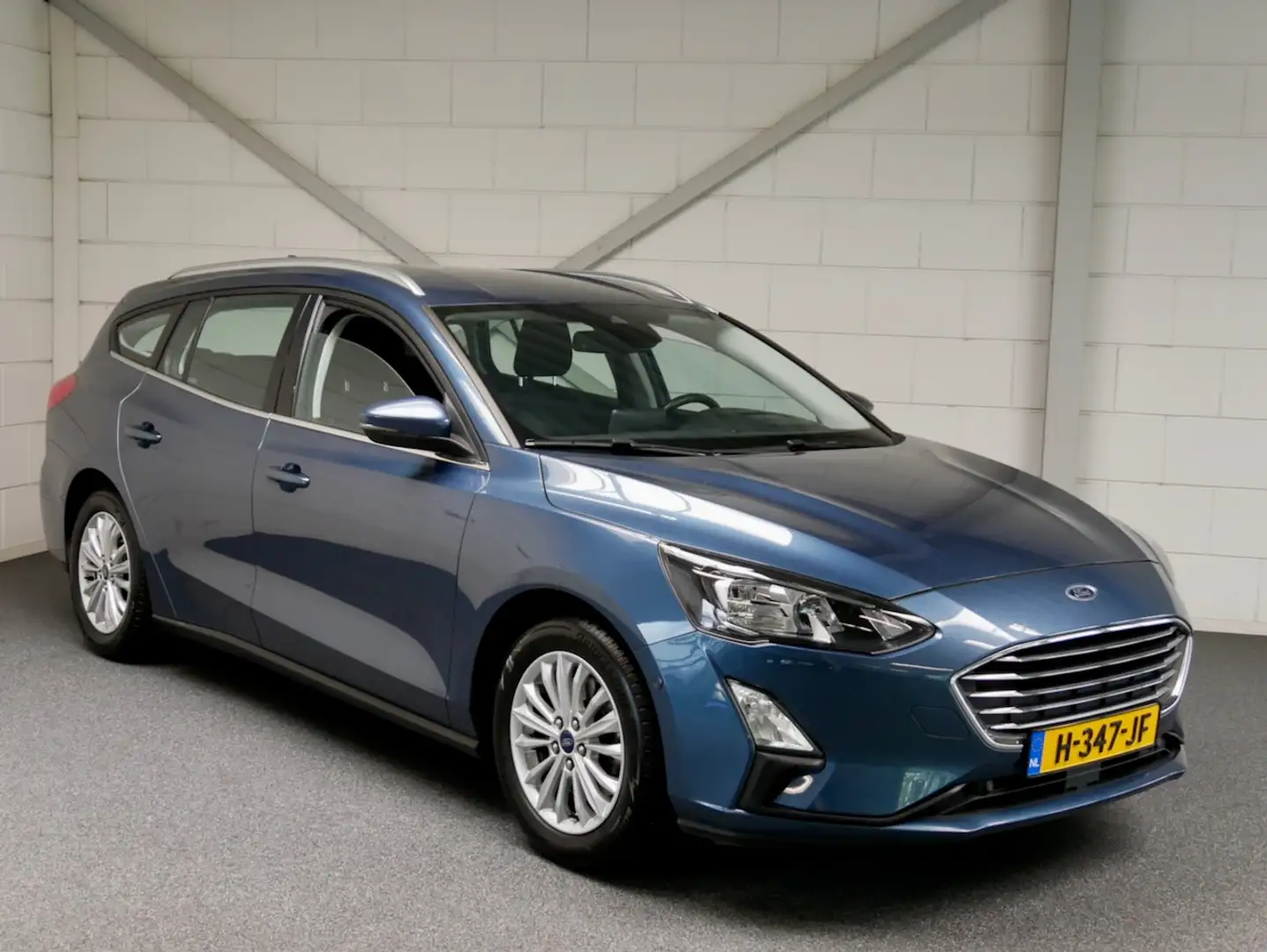 Ford Focus Wagon 1.0 125pk Titanium Navi/ECC/AGR/Cam/TH/Carpl Blauw - 1