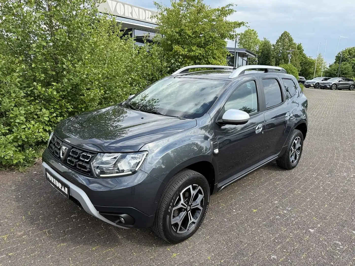 Dacia Duster Prestige blue dCi 115 4x4 SHZ Navi Klima PDC+360° Grau - 1