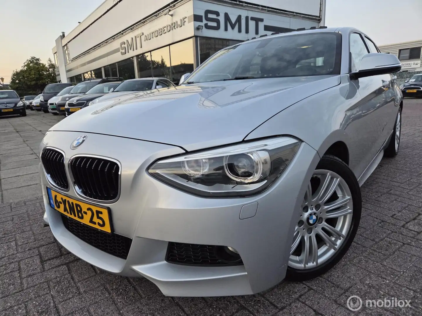 BMW 116 1-serie 116i M Sport Aut/Nav/Xenon/Schuifd/NLAuto/ Gris - 1