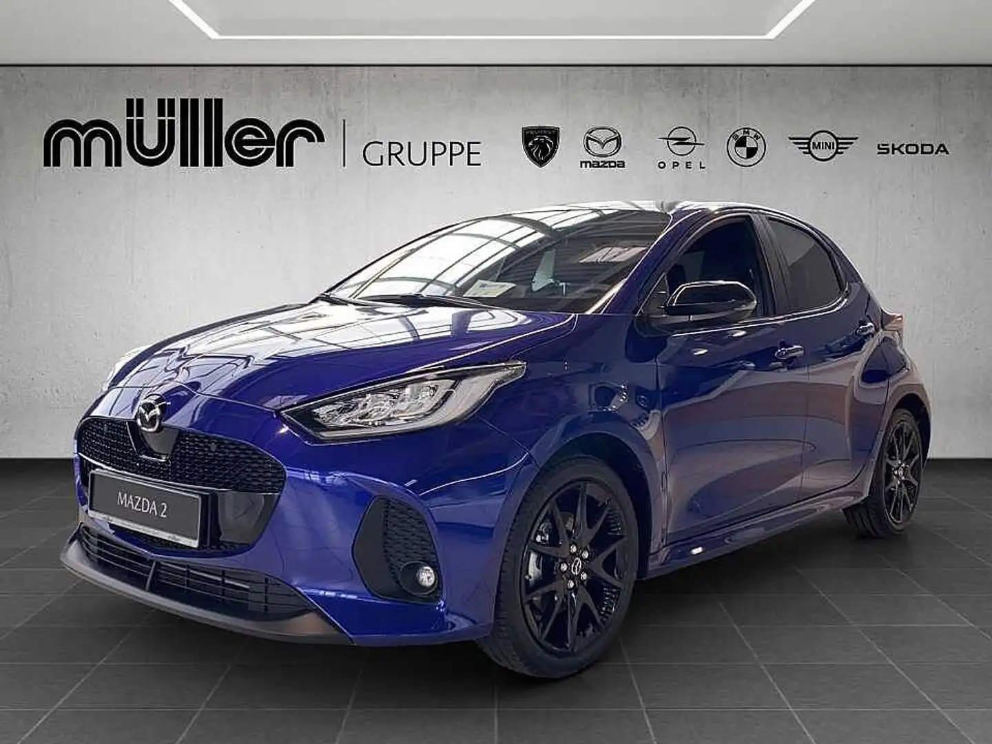 Mazda 2 Hybrid VVT-i 116 PS e-CVT FWD HOMURA PLUS VVT-i 11 Blau - 1