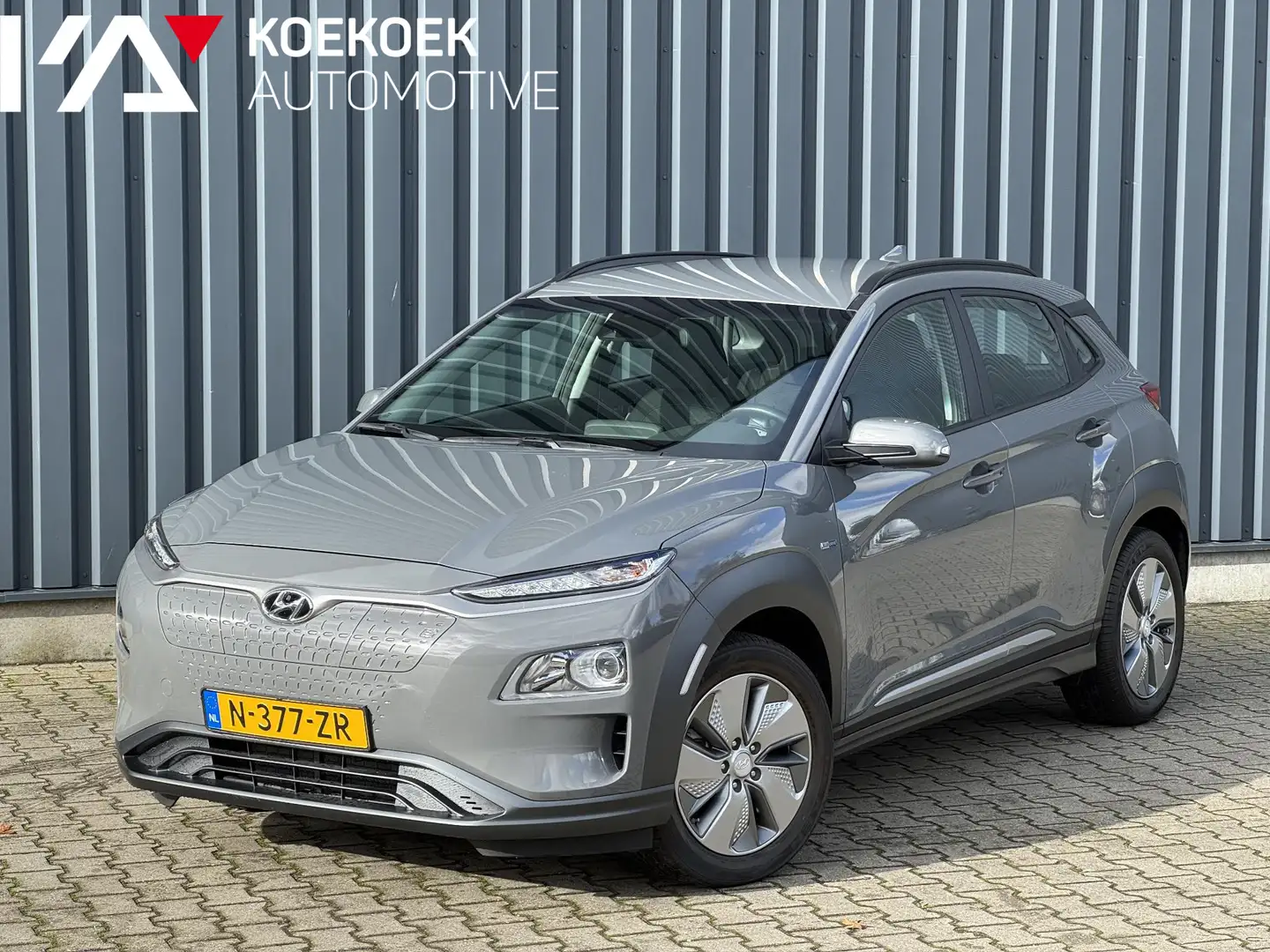 Hyundai KONA EV Comfort 39 kWh | Achteruitrijcamera | Keyless Grau - 1