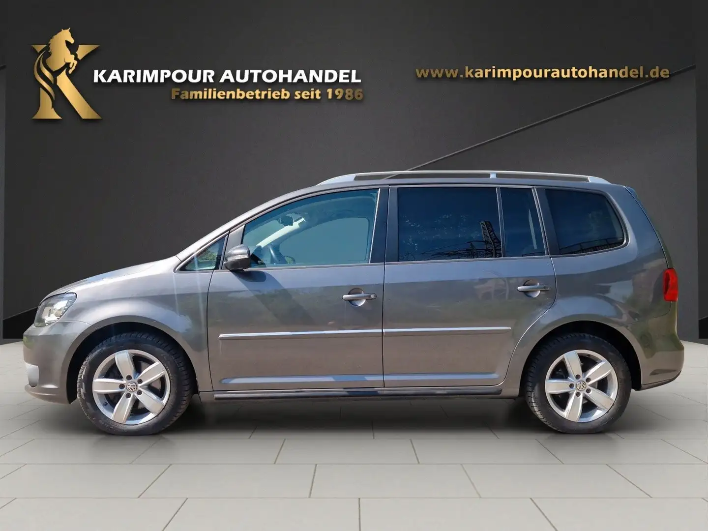 Volkswagen Touran Highline BMT*7-Sitze*Navi* Grijs - 2