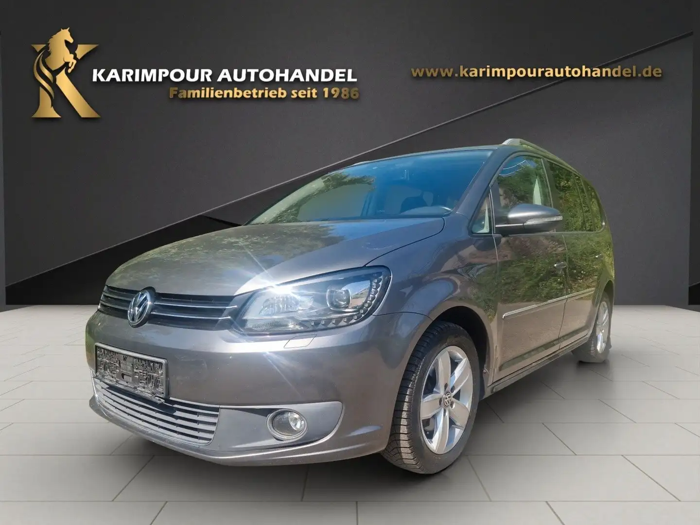 Volkswagen Touran Highline BMT*7-Sitze*Navi* Grijs - 1