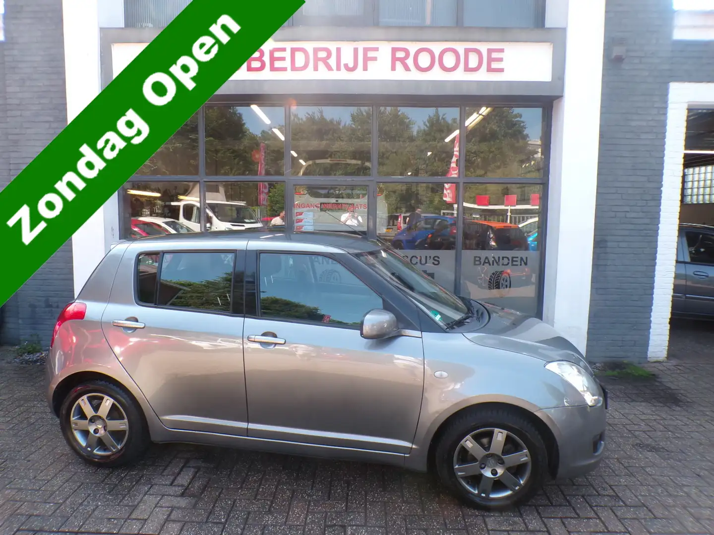 Suzuki Swift 1.3 5-Drs Comfort AIRCO, LMV! ""ZONDAG OPEN "" Grijs - 1