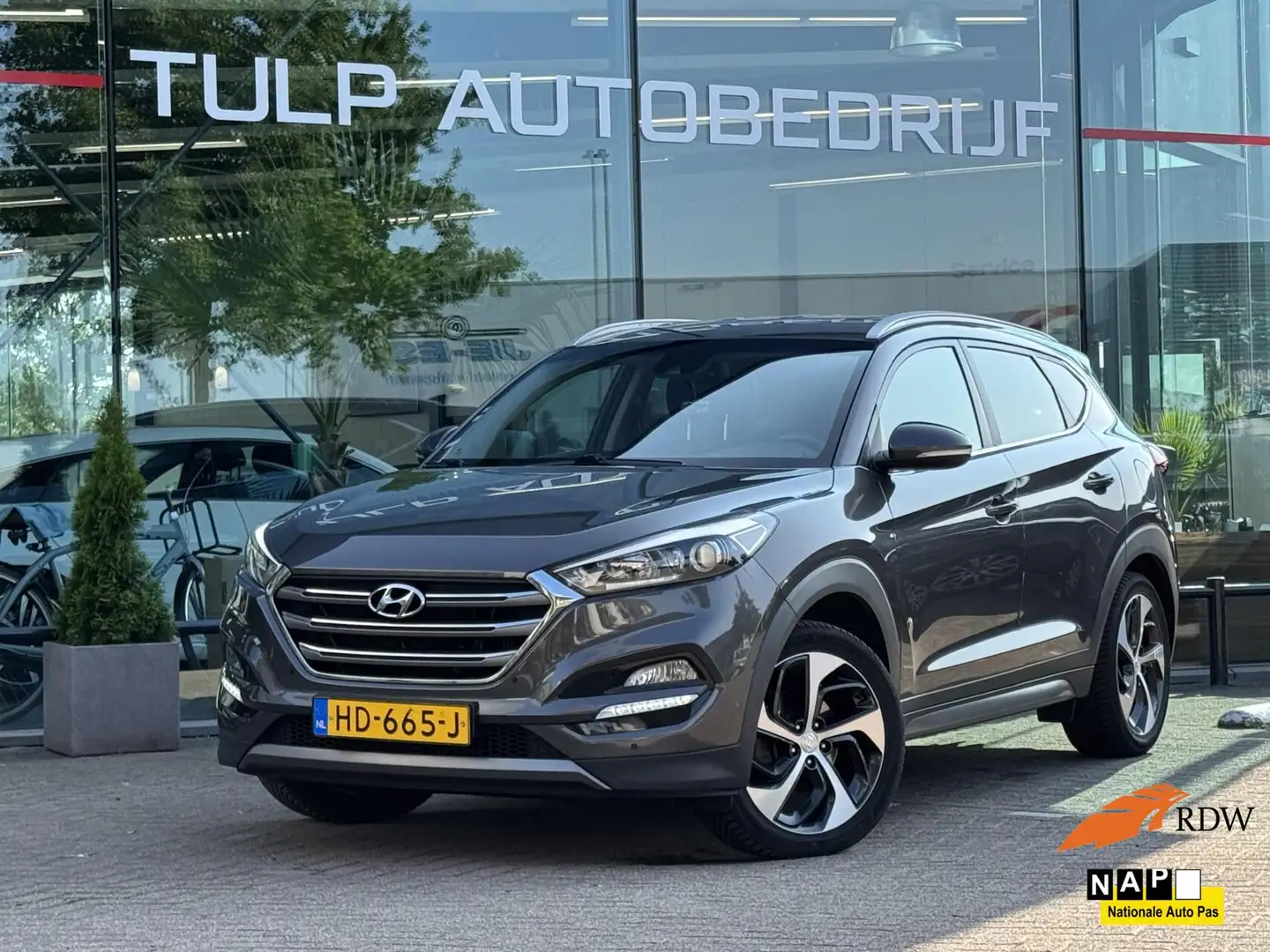 Hyundai TUCSON 1.6 T-GDi Comfort 4WD Automaat Trekhaak NAP Bruin - 1