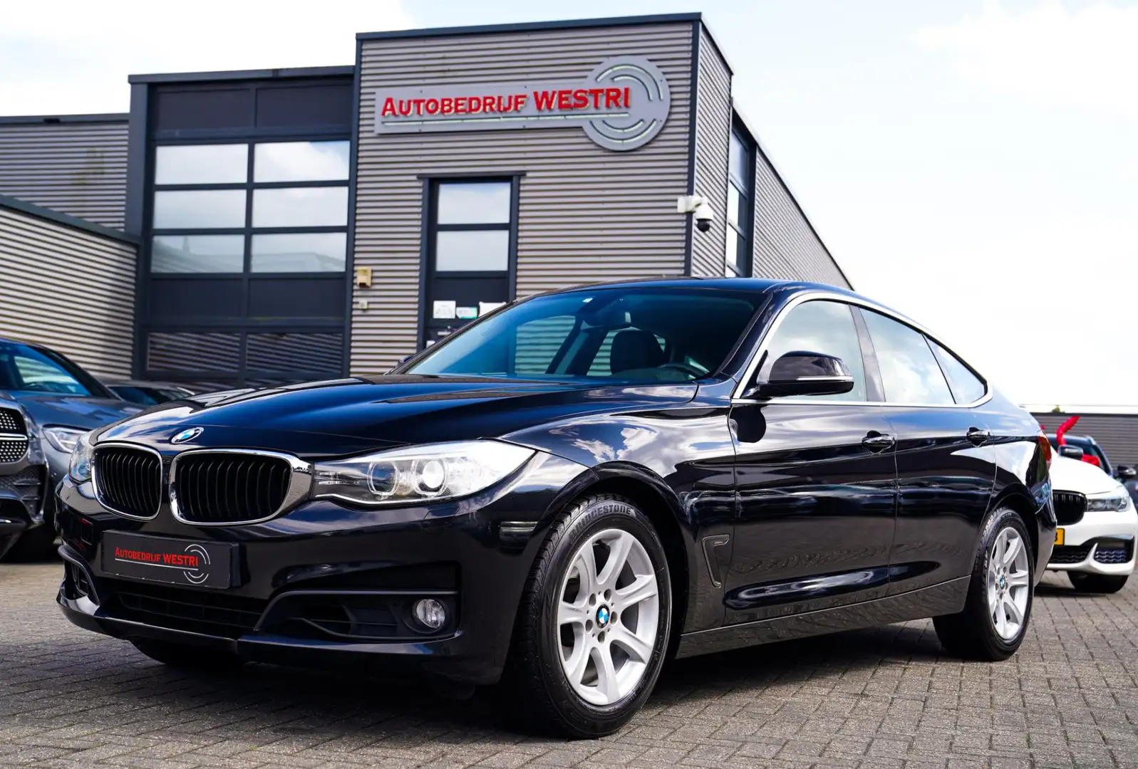 BMW 320 3-serie Gran Turismo 320i High Executive | Xenon / Zwart - 1