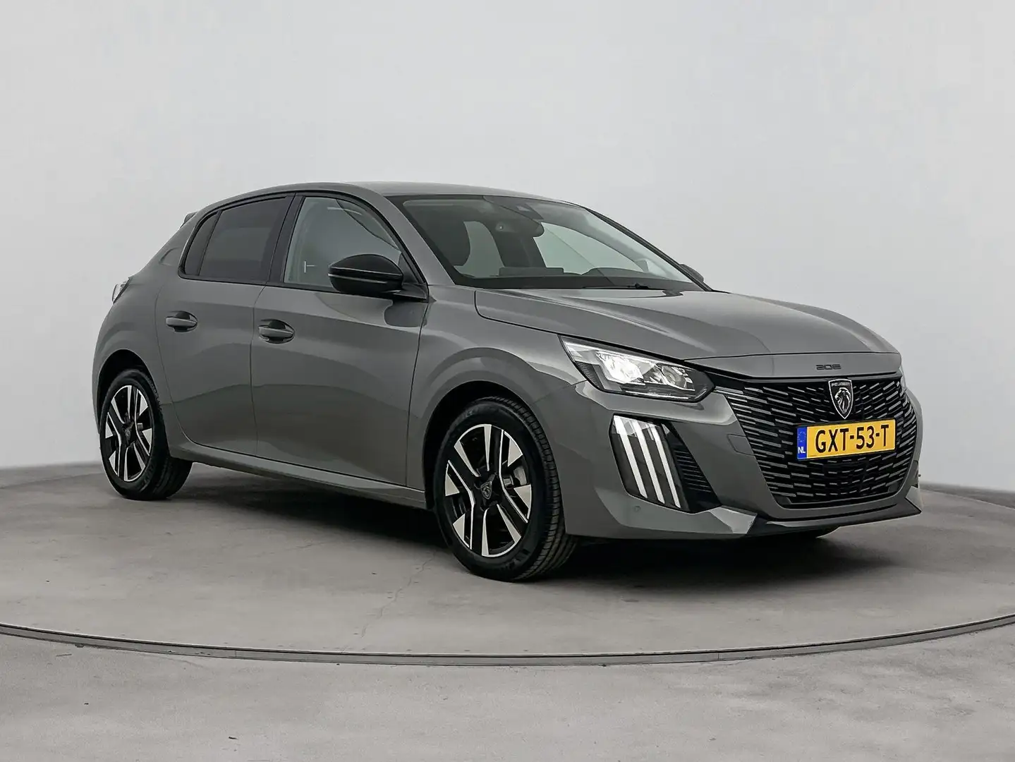 Peugeot 208 1.2 100 pk Allure | Navigatie |  Apple Carplay | V Grijs - 2