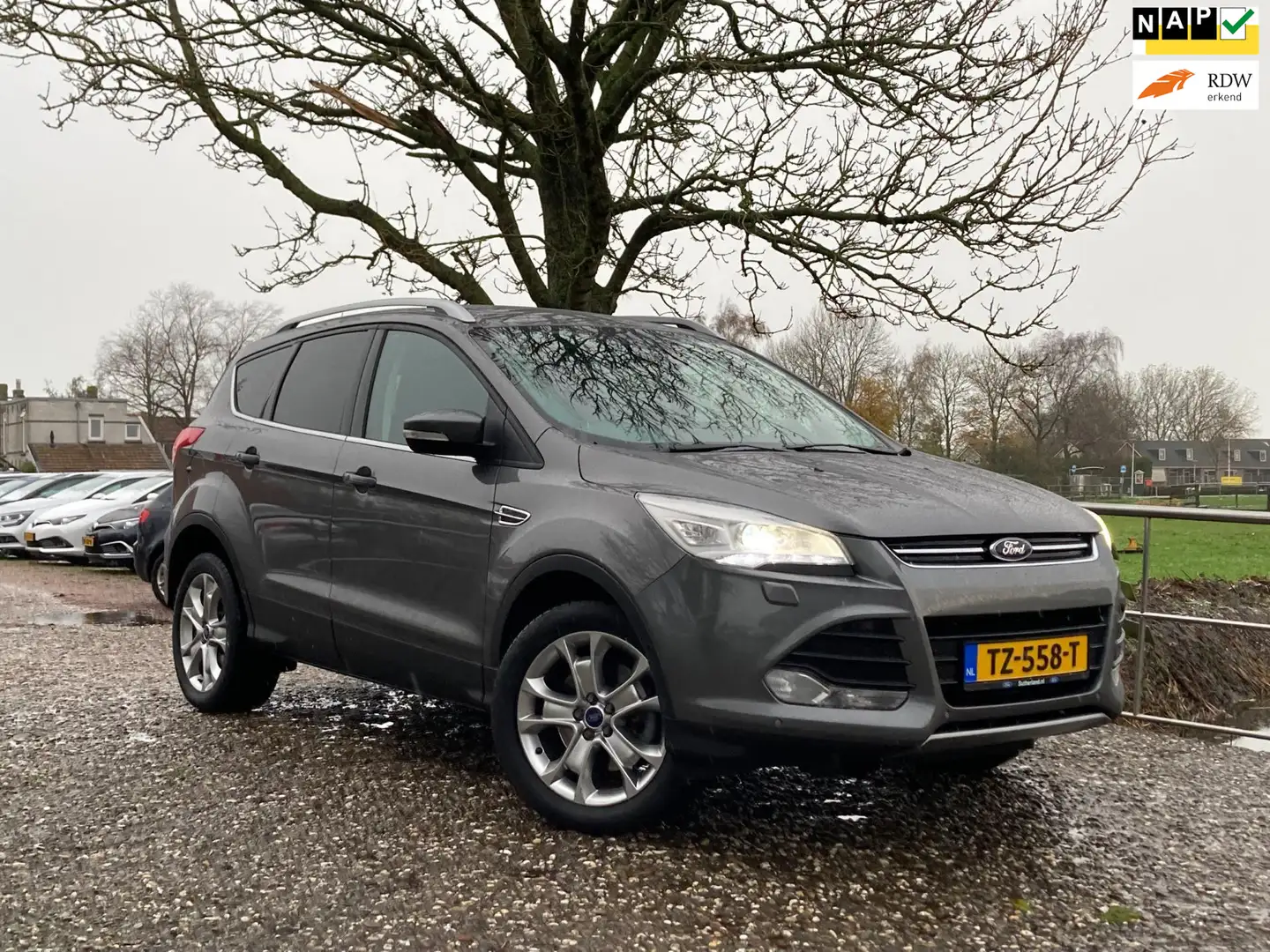 Ford Kuga 1.6 Titanium Plus 4WD| Automaat + Pano + Cruise Nu Grau - 1