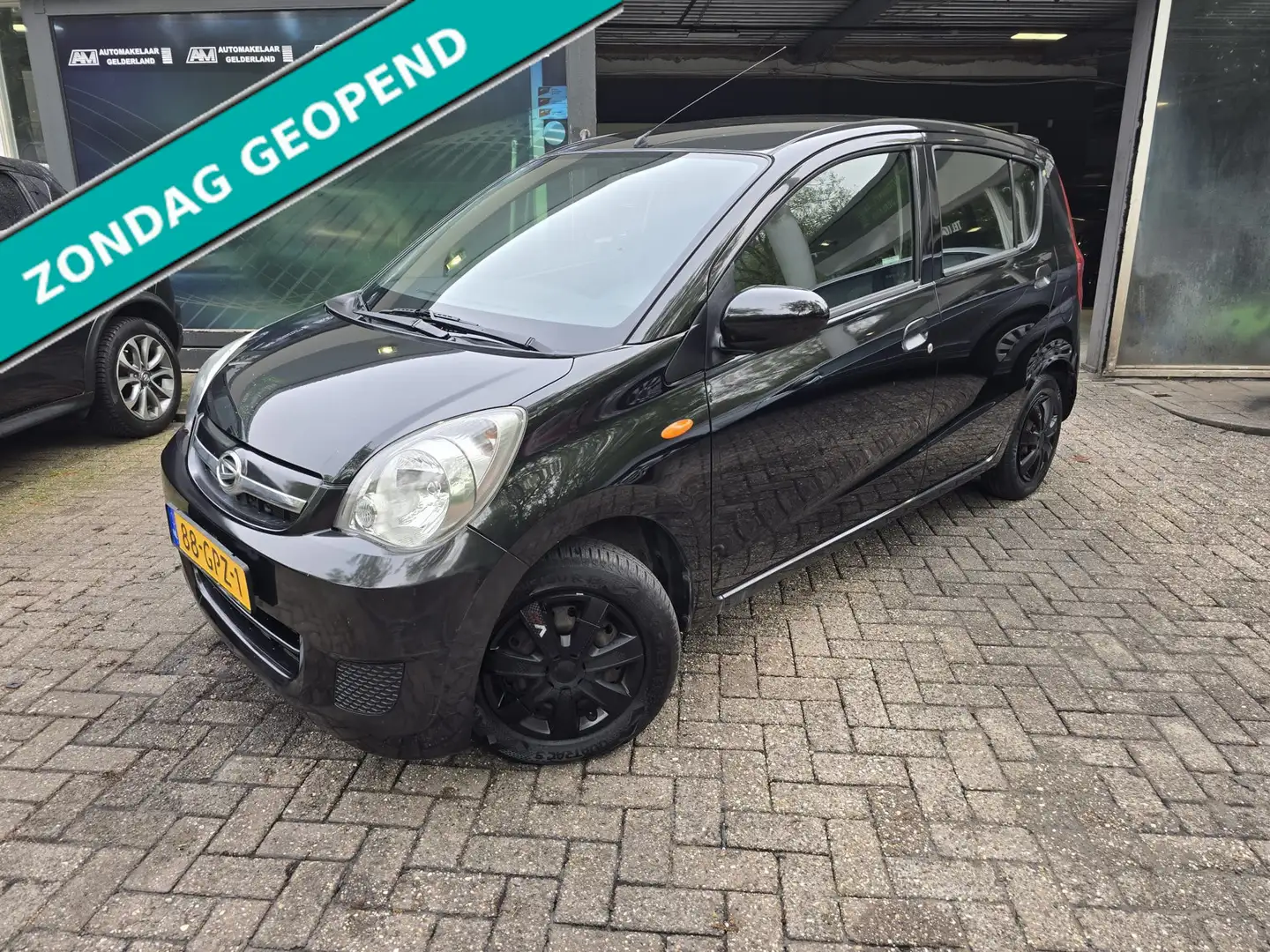Daihatsu Cuore 1.0 Premium | 1E EIGENAAR | 12MND GARANTIE | AIRCO Schwarz - 1