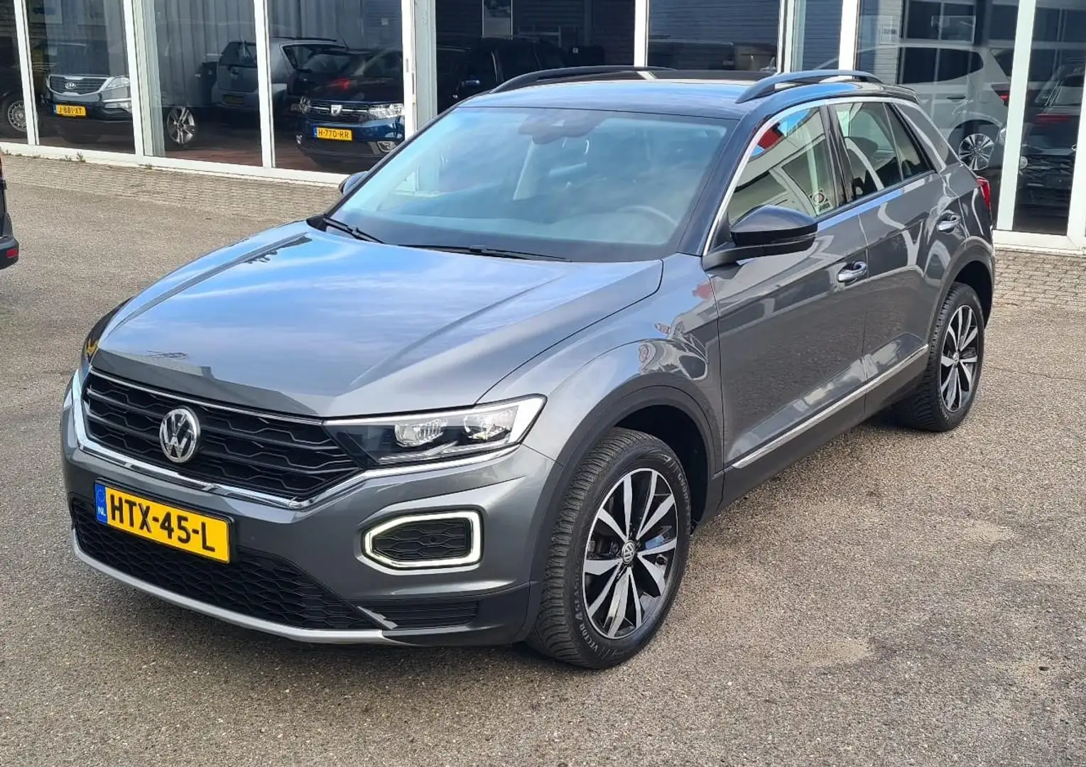 Volkswagen T-Roc 1.0 TSI Style Business Clima,Pdc,Cruise,RIJKLAARPR Gris - 1