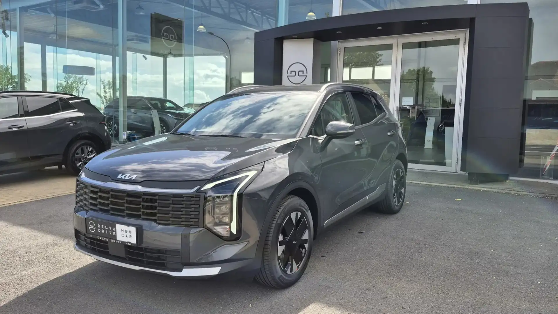 Kia Sportage 1.6 T-GDi Pulse DCT7 ✅ FACELIFT MODEL 26! Grijs - 1