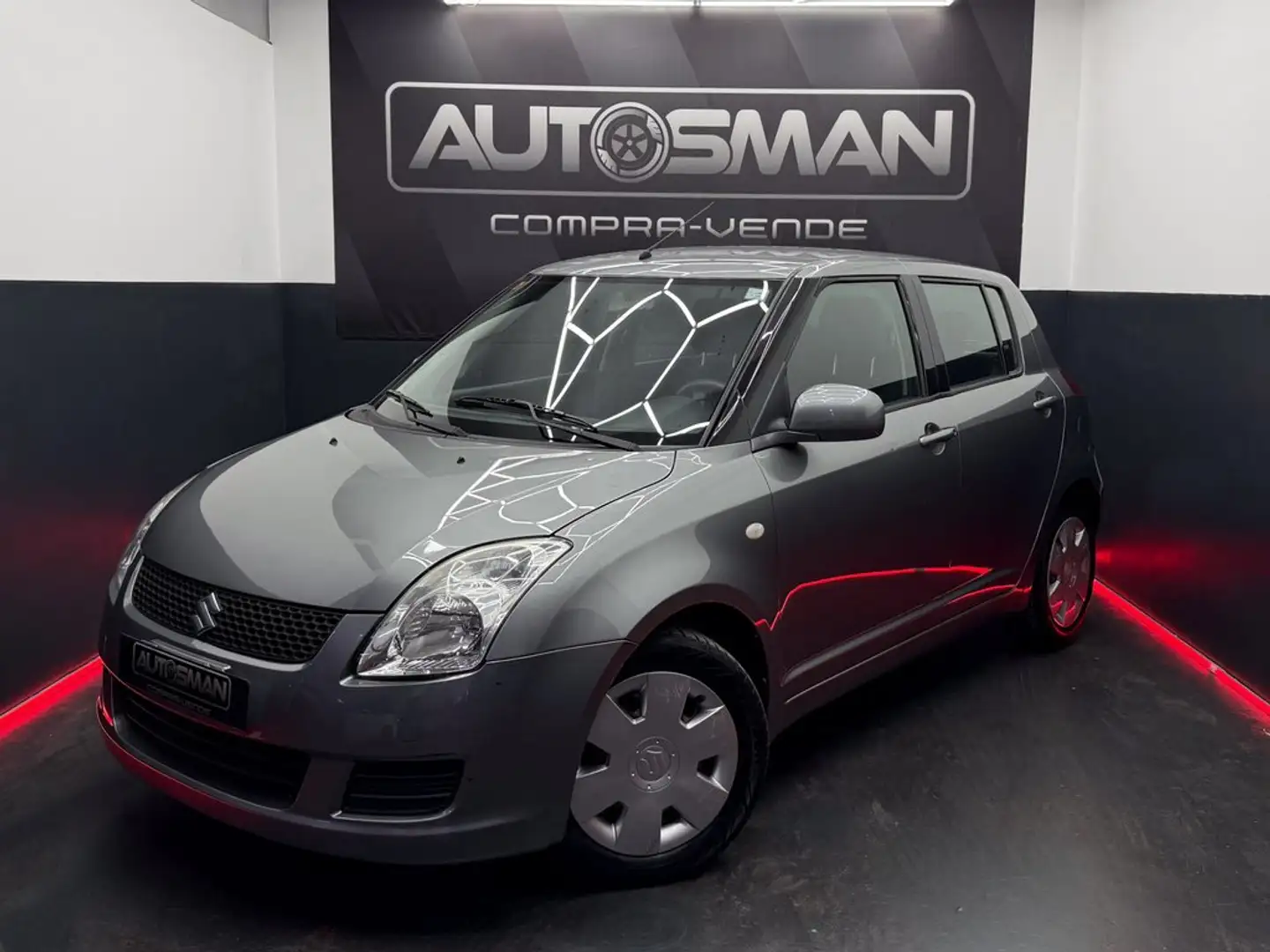 Suzuki Swift 1.3 GLX Gris - 1