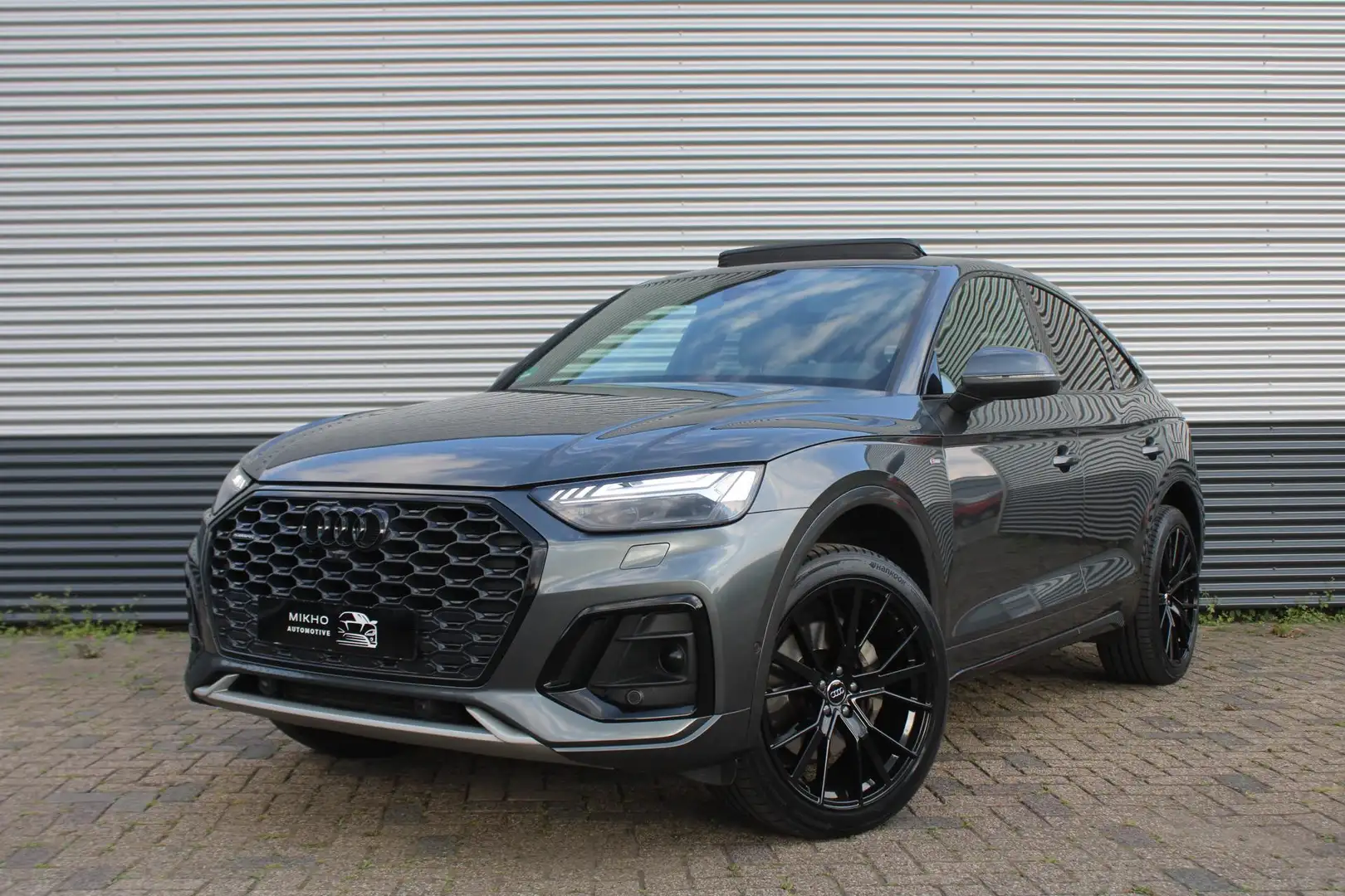 Audi Q5 Sportback 50 TFSI e 3x S-Line | Competition | Pano Grijs - 1