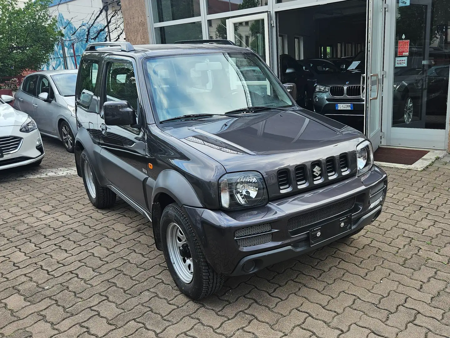Suzuki Jimny 1.3 vvt Special 4wd E5 GANCIO TRAINO-SENSORI Gris - 1