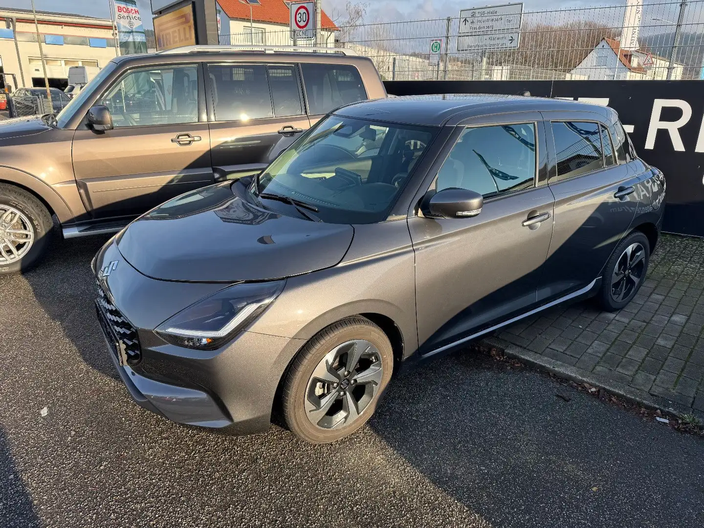 Suzuki Swift 1.2 Dualjet Hybrid 61 kW Comfort+ Grau - 1