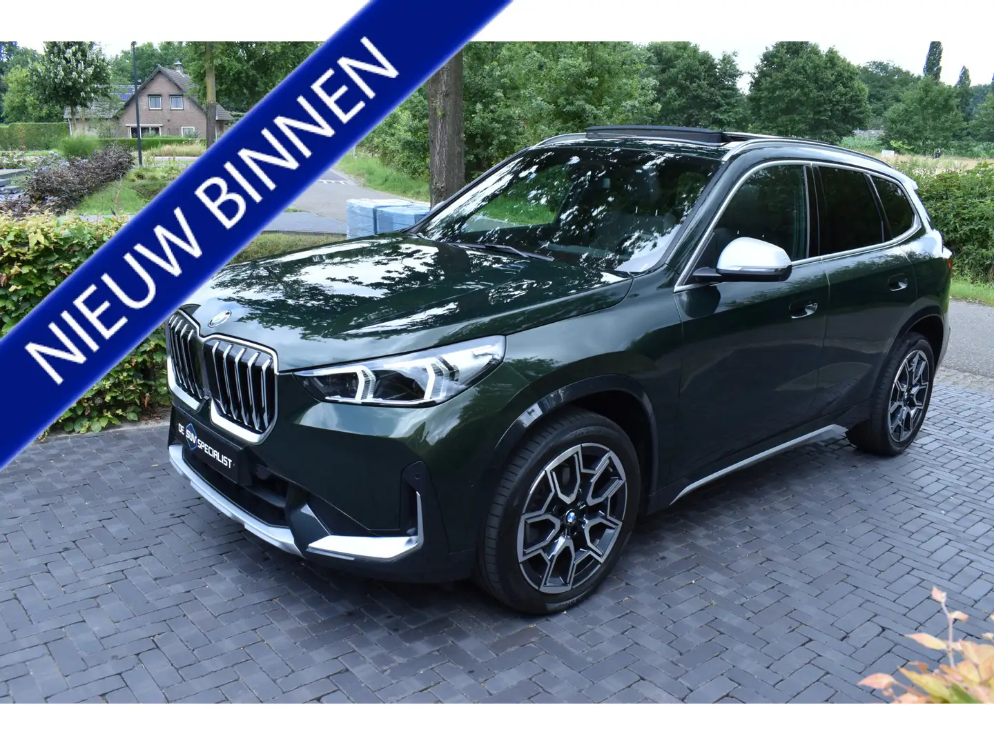 BMW X1 sDrive18i '23 FULL, LEER, PANO, ADAPT, NIEUWST. Groen - 1