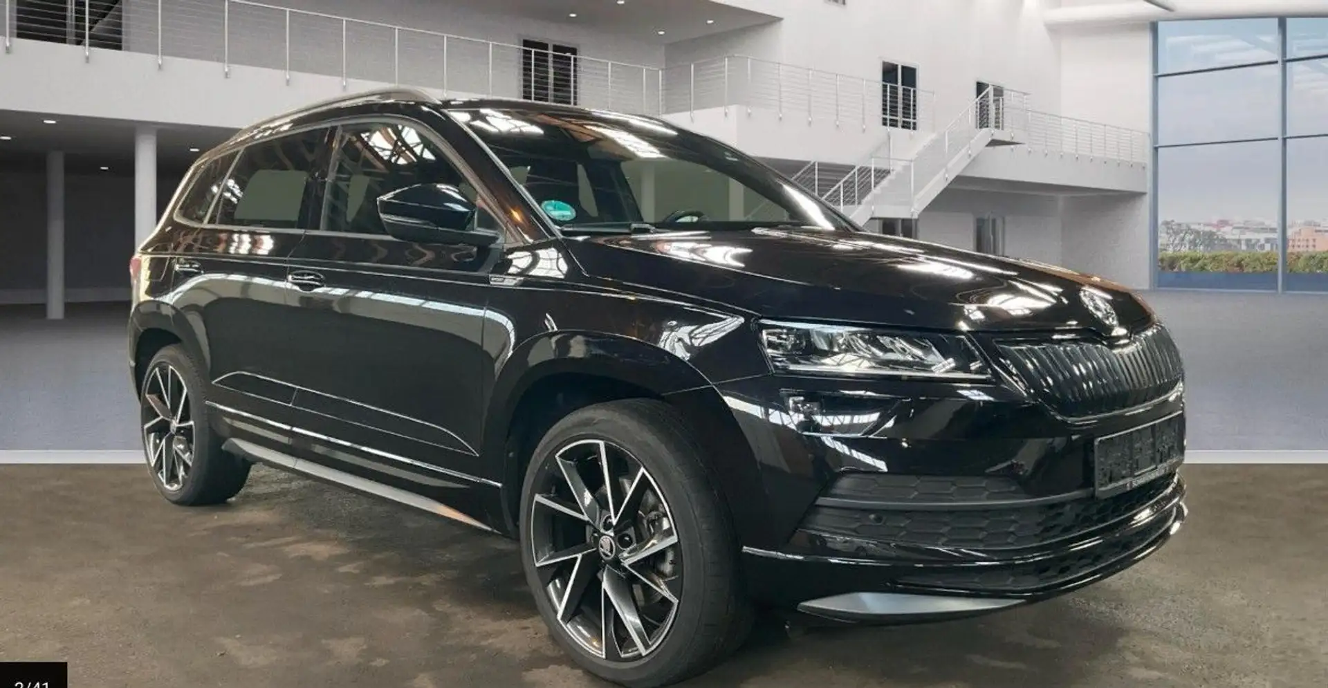 Skoda Karoq 2.0 TSI 4X4 DSG Carplay Standhzg Kam. AHK Zwart - 1