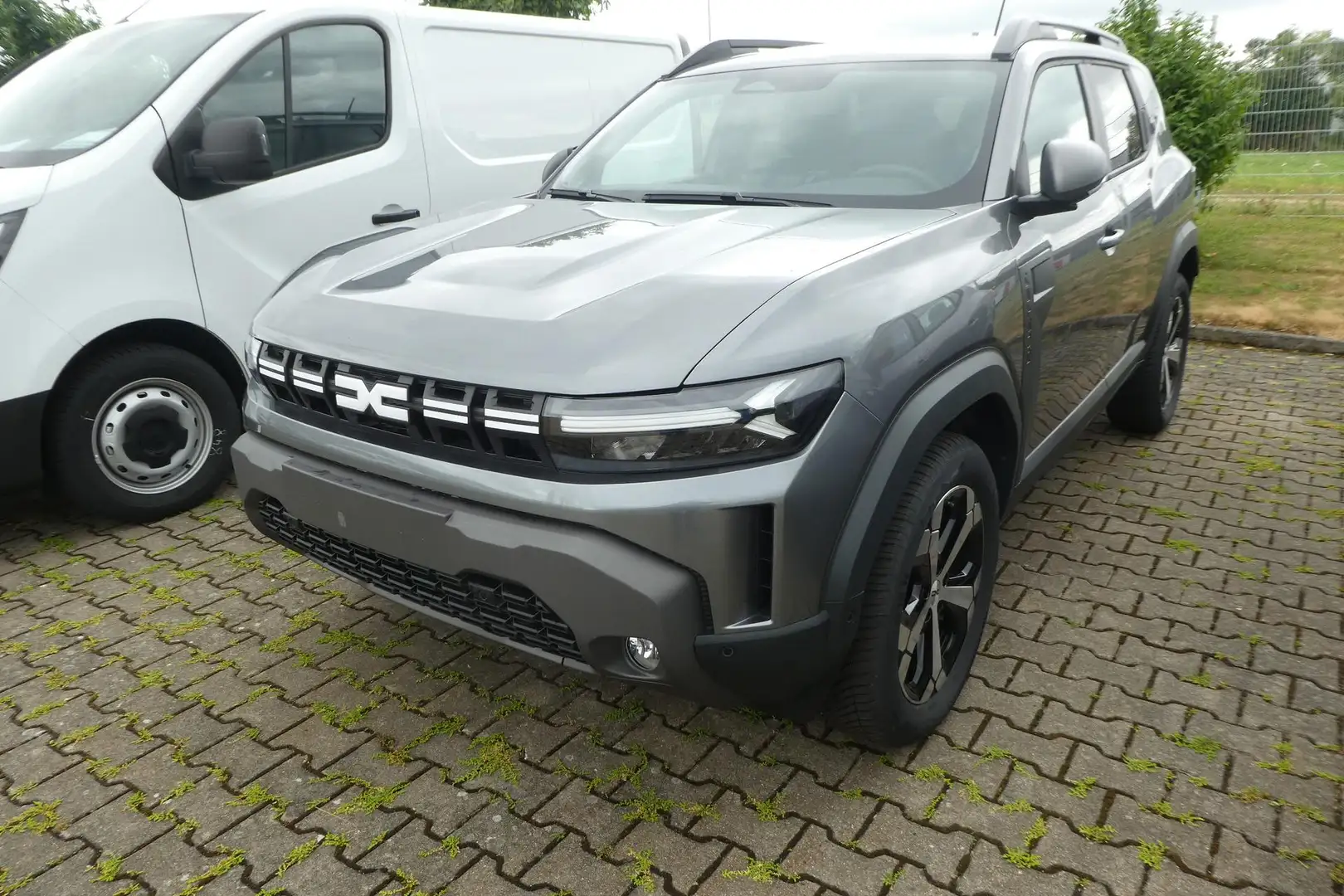 Dacia Duster III 1.2 TCe 130 Journey 4x4 96 kW (131 PS), Sch... Gris - 1