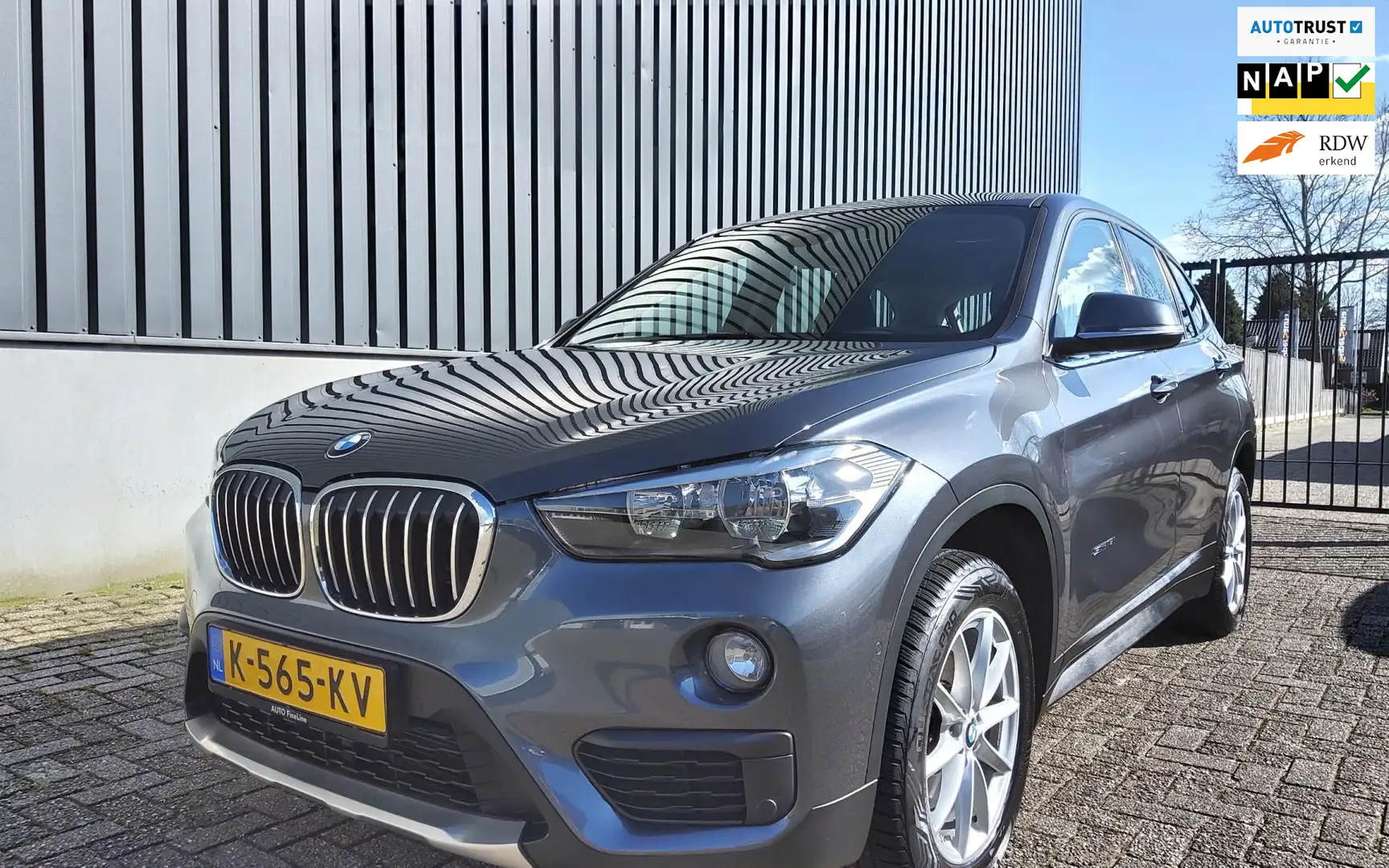 BMW X1 SDrive18i|AUTOMAAT|NAVI-PDC-CLIMA-LED®|90.000km NA Grijs - 1