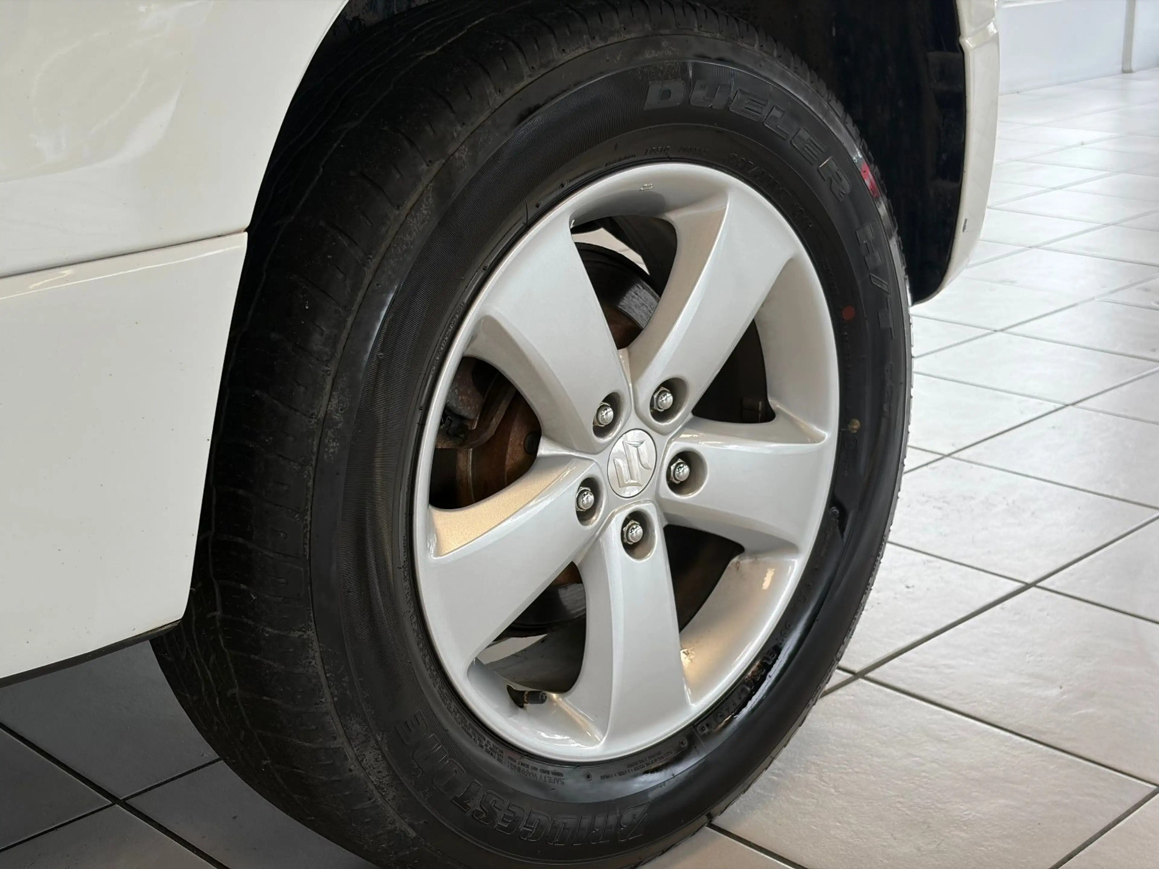 Suzuki Grand Vitara 1.9 DDIS Comfort · 4x4 · PDC — photo 11