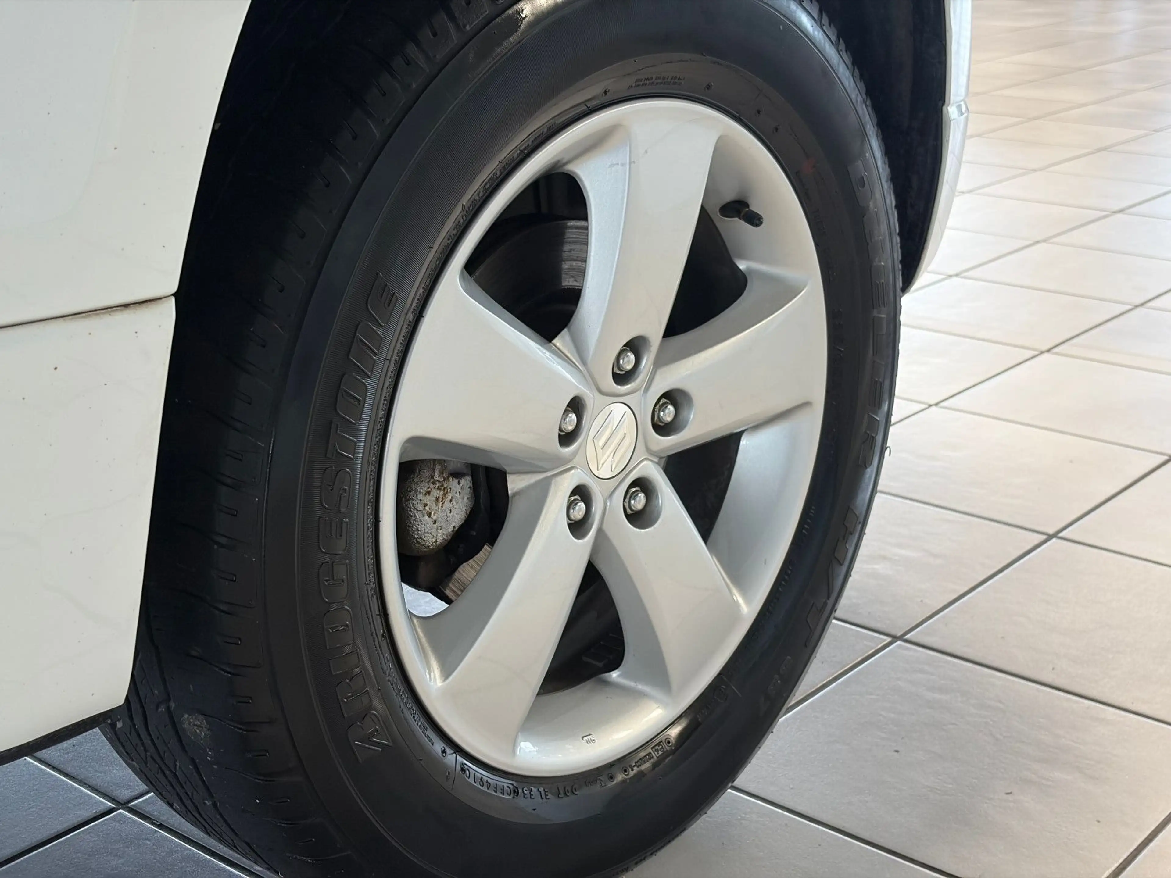 Suzuki Grand Vitara 1.9 DDIS Comfort · 4x4 · PDC — photo 13