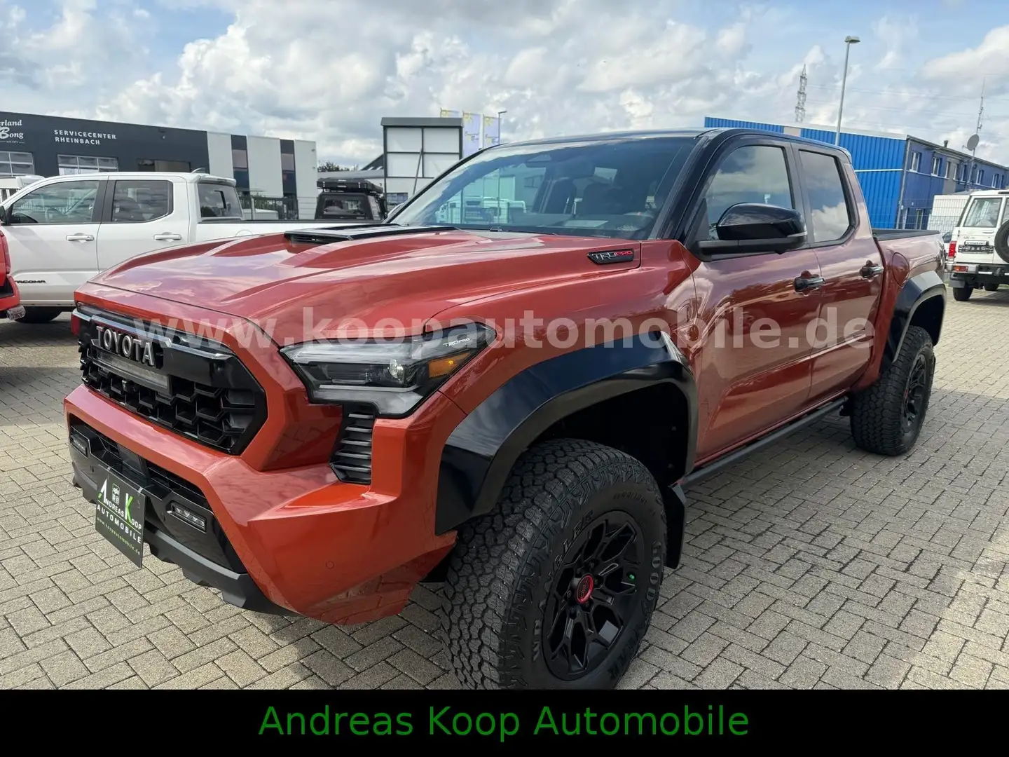 Toyota Tacoma MY24 TACOMA DC 326PS TRD PRO HYBRID STOCK Brown - 1