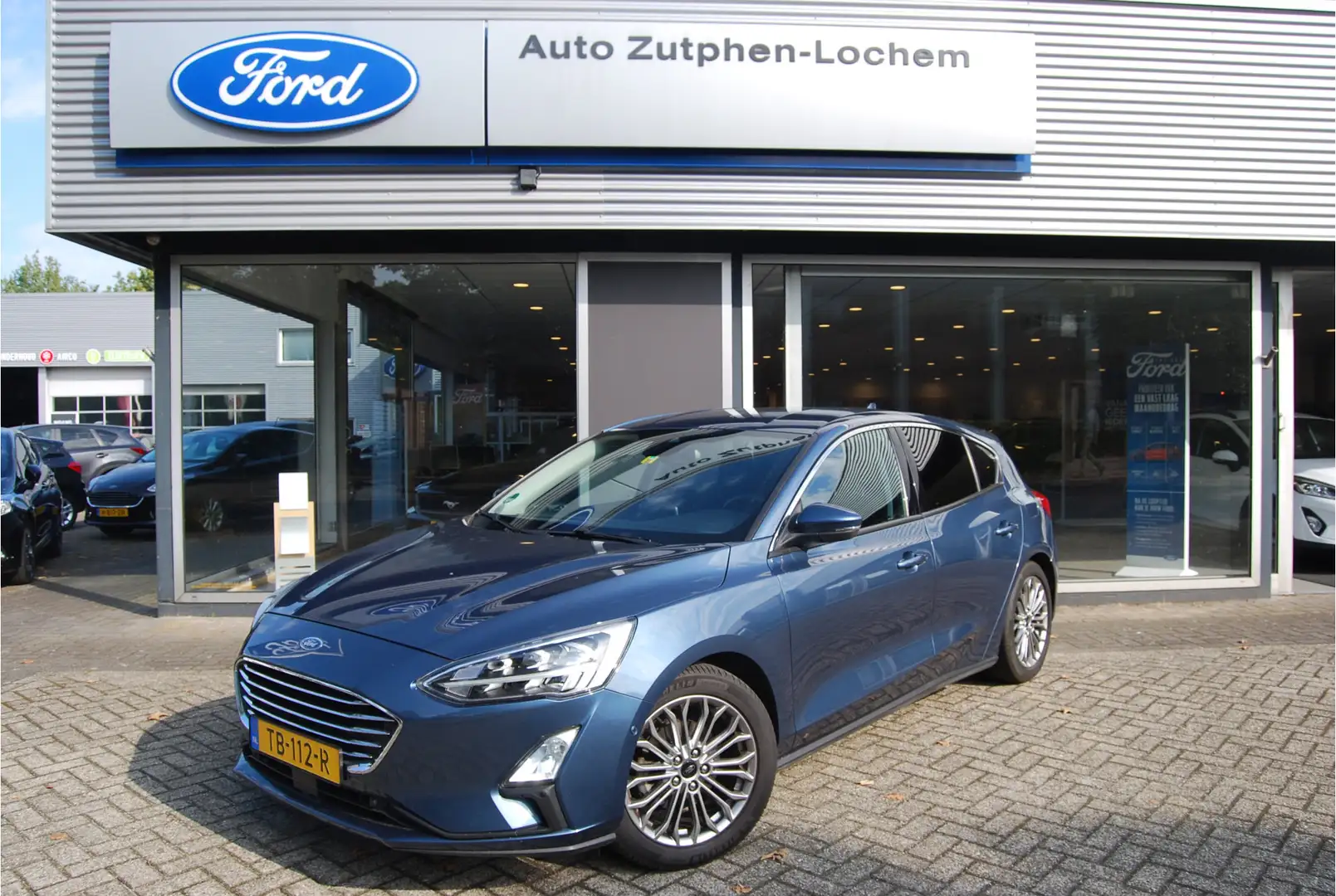 Ford Focus 1.0 EcoBoost 125pk Titanium 5DRS | NL-AUTO | TREKH Blau - 1